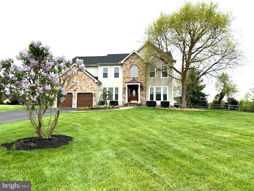 This lovingly maintained 4 BR 3.5 Bath colonial home sits on a nearly 1 acre large level lot in a wonderful family oriented neighborhood, with a community pond stocked with fish, less than a 0.5 mile walk to Elk Neck elementary school, and easy access to I-95, nearby marinas, and parks. Welcoming paved entry and colorful flower bed showcases the curb appeal of this partial stone front. Welcome home to a 2 story foyer with hardwood floors that continue through french doors to the office with custom built in shelves and lighting.
The beautiful gourmet kitchen features stunning granite countertops, custom tile backsplash, designer range hood, and copper accent details. Enjoy the benefits of almost new ENERGY STAR appliances such as the ultra quiet dishwasher, GE profile ceramic cooktop and the double wall oven. The open format kitchen is adjacent to the family room with a gas fireplace, surrounded by stonework that creates a wonderful space for family gathering. The breakfast area opens to a large screened full patio with ceiling fans for the warm days and propane heater for those chilly nights. Off the other side of the kitchen is a formal dining room with crown molding and wainscoting that open into a living room space. Upstairs, retreat to an absolutely MASSIVE primary bedroom with a tray ceiling, complimented by a huge sitting room-like space and an enormous
L-shaped walk-in closet. There are also 3 generous sized bedrooms upstairs with a convenient large second floor laundry room with cabinets and countertop. A 50 Amp level 2 car charging receptacle in the garage is ready for your EV. The basement is finished with a potential to create a 5th bedroom, and is complete with a full bath. Loads of flex space available to create a fitness area, theater, or game room. Hardie Board siding and new windows updated the front of the house (2021), new roof (2022), new HVAC (2022) and a new hot water heater (2023).