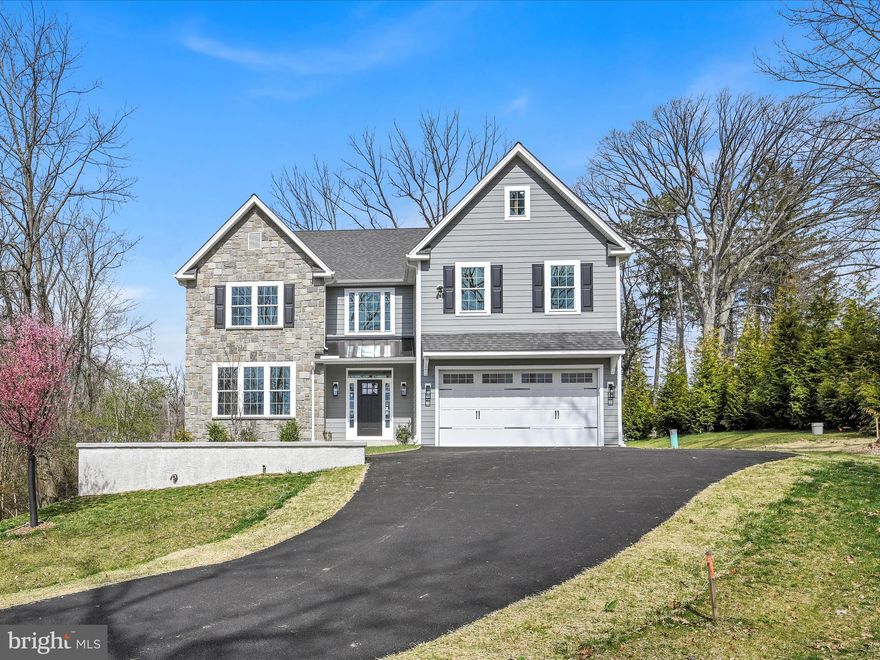 Meticulously constructed with pride of craftmanship, this spectacular home sits atop 1.33 acres, located in the heart of Newtown Square in the highly desirable St. Albans neighborhood. The curve of the driveway guides you over a small stream and through a natural landscape, provided by the oversized lot, then cresting the rise to your private courtyard, defined by attractive retaining walls, a Stone and Cement Fiber siding exterior with metal, standing seam accent roofing over the covered main entryway and a 2-car attached garage with direct home access. The 1st level with a 2-story entry hall with a solid craftsman-style entry door with divided light glass and transom window welcomes you into your home with both private spaces and an open concept living area, an ideal layout suited to today’s lifestyle. The 2nd floor boasts a primary suite with an inverted tray ceiling, two walk-in closets, and a primary bath with double vanity, a stall shower with frameless glass walls, and a free-standing soaking tub. The 2nd and  3rd “Jack & Jill” bedrooms are split by a tiled bath with centered tub and toilet area with flanking spaces accessed by pocket doors to vanities and quartz tops. The 4th bedroom has an in-suite bath with stall shower and beautiful accent tile and framed glass doors. This level is finished off with a spacious 2nd floor laundry with single tub vanity, wall cabinets, and hookups for a washer and gas dryer. The basement features high ceilings, two windows and sliding door access to grade, which offers great expansion potential. Some of the numerous amenities of this home include high efficiency dual zone heat and air, a home office space, site finished, 3/4” solid oak flooring, high ceilings, quality entry doors and black hardware, generous lighting package, attractive moldings to include high baseboard, oversized casing on door and window frames, panel moldings and two piece chair and crown moldings, a family room floor to ceiling, stone, gas fireplace with slate hearth and mantle, mud room with built-in cubby and a 12’ x 12’ composite deck with vinyl rail. The kitchen with large eating area offers beautiful white wood cabinetry with contrasting center island and wet bar, quartz tops and tiled backsplashes, GE café appliances, and large pantry closet.  The heavily landscaped lot provides a private setting yet sits directly across the street from Ellis preserve, a 218-acre pedestrian friendly site featuring numerous retail and dining options to include Whole Foods, Hilton Garden Inn, Chesterbrook Academy, Main Line Heath Center, Ellis Athletic Center, and so much more. This home offers it all – why not have it!