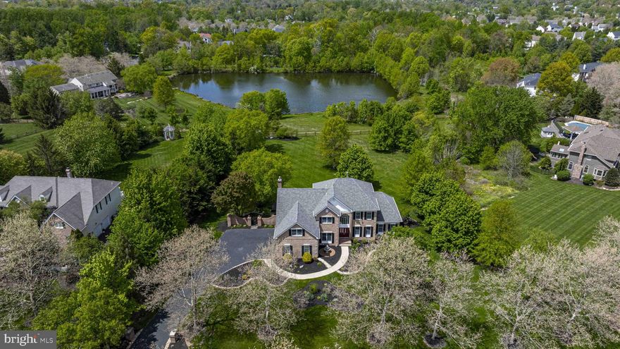 Looking for space for in-laws, extended family, an au pair, or a grown child and their family? This exceptional home truly has it all. 7 bedrooms3.5 baths in all!

Set on nearly a full picturesque acre overlooking a neighboring pond, this stately residence offers both elegance and flexibility. A grand two-story entry welcomes you with rich wood flooring and a stunning curved staircase. Just off the foyer, a generously sized office provides the perfect work-from-home space.

Designed for entertaining, the expansive living and dining rooms are ready for gatherings of any size. The sun-filled solarium/game room is lined with windows showcasing the lush yard, while the oversized family room offers serene views of the grounds and pond beyond. The chef’s kitchen is fully equipped to inspire everything from casual meals to gourmet creations.

Upstairs, the luxurious owner’s suite is a true retreat, featuring a spacious bedroom, a private sitting area, and a spa-like en suite bath complete with a beautifully tiled shower and a soaking tub overlooking the scenic landscape. Three additional well-sized bedrooms and a hall bath complete this level.

The walk-out lower level adds approximately 2,100 square feet of living space, including three bedrooms, a full kitchen, a family room, a bonus room, and a full bath—perfect for multi-generational living or guest quarters. This level also features ample storage and a private patio.

Enjoy outdoor living on the low-maintenance deck with plenty of space to relax and entertain while taking in tranquil pond views—beautifully lit at night for added ambiance. The property is surrounded by mature trees, natural stonework, and lush landscaping, with a large grassy yard ideal for recreation.

Lots of parking in the 3 car garage and oversized driveway.  Located in the highly regarded Central Bucks School District, just minutes from downtown Doylestown and New Hope, and conveniently close to a nearby train station for commuters.  This one will go fast so make your appointment with me today!