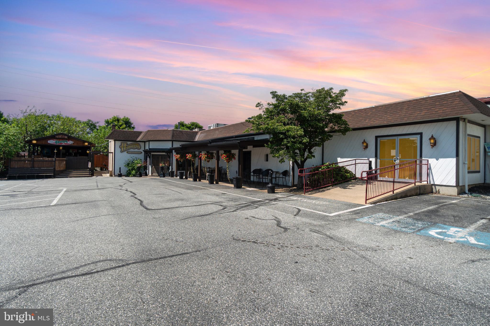 Restaurant is also listed for lease at $15psf NNN. This listing is offering the potential to condo the real estate for purchase. Hennigan’s has been a beloved community gathering place for more than 36 years, offering casual dining, outdoor seating, live entertainment, and family-friendly fun. Its direct connection to Clearview Lanes creates a unique synergy, drawing cross-traffic from bowling patrons, birthday parties, team-building events, and fundraisers. The restaurant benefits from excellent visibility and easy access along Main Street (Route 230) between Mount Joy and Elizabethtown, with 142 shared parking spaces on-site to accommodate steady customer flow. This ±9,467 square foot restaurant, located within a 31,685 square foot building, presents an exceptional opportunity for an incoming operator. Offered as a turnkey restaurant with a full-service kitchen and liquor license available, the space includes indoor dining for 127 guests, a large outdoor dining deck with outdoor bar and pavilion seating. Ample space for outdoor music/entertainment, too! Its large capacity and versatile layout support both day-to-day operations and special events, private parties and live entertainment. The property’s longstanding reputation, strong community presence, and built-in traffic from Clearview Lanes provide a solid foundation for continued success. With the nearby Mount Joy Towne Center mixed-use development set to bring increased population, traffic, and visibility, this property offers the chance to capitalize on decades of recognition while tapping into future growth in one of Lancaster County’s thriving markets.