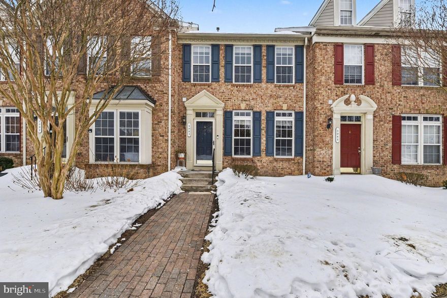 This brick-front townhome offers a comfortable layout with thoughtful features throughout. The main level includes wood floors, 9-foot ceilings, and an open kitchen with granite counters, an island, and 42-inch cabinetry, creating a space that works well for everyday living and entertaining. Just off the kitchen, a large deck provides an easy extension of the living area.

Upstairs, the primary suite features a walk-in closet and a private bath with a double vanity and soaking tub. The second bedroom has convenient access to a full hall bath, while the finished lower level offers flexible space that could serve as a third bedroom, home office, or additional living area, along with its own bathroom. A true two-car garage includes an EV charger, and the location places you close to shopping, dining, and entertainment.