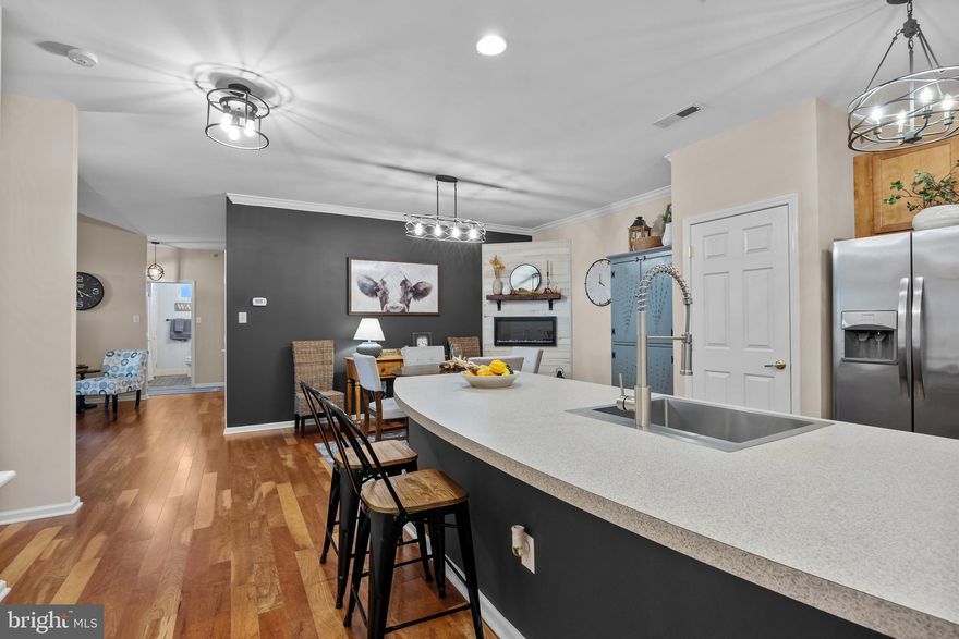 Welcome to 265 Covenant Lane #8 — a stylish and move-in ready condo offering comfort, convenience, and low-maintenance, 1 floor living in the heart of Harleysville. With 3 bedrooms, 2 full baths, and 1,452 square feet of thoughtfully designed space, this home is part of a small 10-unit community that combines privacy with a welcoming neighborhood feel. An individual storage unit in the basement of the building provides the added storage everyone can appreciate. 

Step inside to find warm hardwood and vinyl plank flooring that flows through the main living areas. The open layout creates a natural connection between the living room, dining area, and kitchen. The updated kitchen features stainless steel appliances, upgraded lighting, and plenty of workspace for everyday cooking or entertaining. The built-in electric fireplace adds a cozy touch.

The master suite includes a beautifully updated bath, while the additional bedrooms offer flexibility for guests, a home office, or hobbies. A second full bath has been refreshed with modern finishes, continuing the home’s clean, contemporary look. Step out onto the outdoor balcony, complete with custom flooring, and enjoy morning coffee or evening relaxation in your own private outdoor space.

Practical upgrades bring peace of mind, including a new HVAC system (2023) and new roof (2025). With low maintenance living and a well-kept community, you’ll have more time to enjoy everything nearby — local shops, dining, and Skippack Village are just minutes away. Routes 113, 63, 476, and the PA Turnpike make commuting easy, while the surrounding area offers parks, trails, and plenty of charm.

Combining thoughtful updates, convenience, and a warm modern style, 265 Covenant Lane #8 is ready for its next chapter. Come see why this Harleysville home is a perfect blend of comfort and easy living!