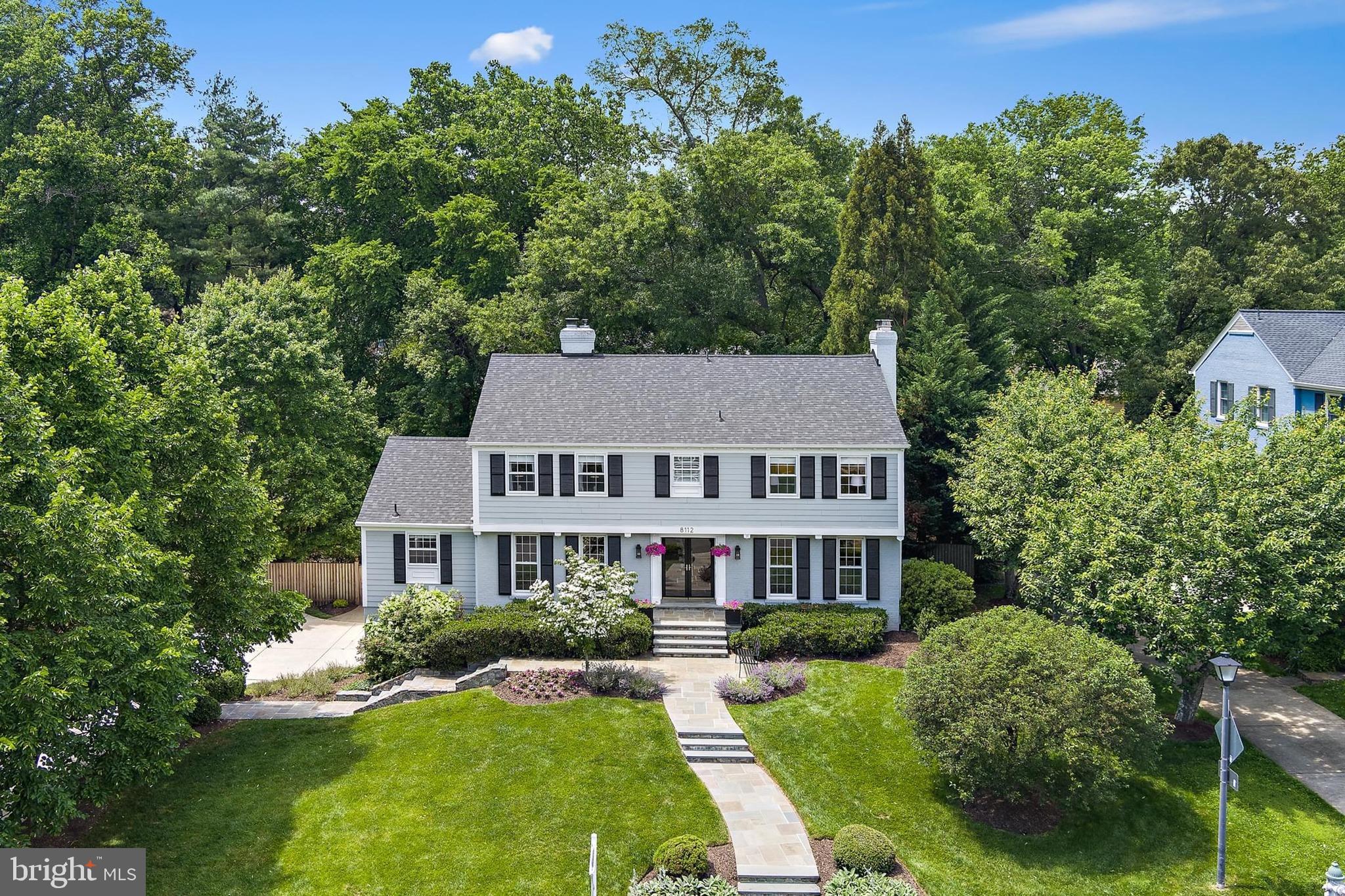 Welcome to 8112 Coach Street, a meticulously maintained gem in the highly desirable River Falls Community. Step from classic stone walkways into timeless elegance and comfort in this beautifully cared-for center hall colonial. Nestled on a quiet street in the heart of the prestigious River Falls neighborhood, this stunning residence offers the perfect blend of classic charm and modern convenience. Upon entry, you're greeted by a spacious open foyer that sets the tone for the home's gracious layout. To the right, a generous living room features a cozy wood-burning fireplace, ideal for family gatherings or relaxing evenings. To the left of the foyer is a formal dining room, perfect for hosting memorable dinners. At the center of it all is the open-concept kitchen, seamlessly connecting to the family room and featuring vaulted ceilings, skylights providing abundant natural light, and a second wood-burning fireplace flanked by beautiful built-in bookshelves. The well-appointed kitchen includes stainless steel appliances, a granite breakfast bar and counters, and a large dining area with French doors leading to a serene elevated deck and screened-in porch, ideal settings for al fresco dining, entertaining, or simply enjoying the beautifully landscaped, oversized private and fully fenced backyard. The main level is rounded out with a powder room for guests.
Upstairs, discover a bright and airy primary suite, featuring a beautifully renovated en-suite bath
finished in Carrera marble, with an adjacent walk-in closet. The second-floor laundry adds everyday convenience, while three additional well-appointed bedrooms and a second fully renovated bathroom offer ample space for family or guests. The finished lower level, featuring a third fireplace, is the ultimate retreat, perfect for game nights, streaming television and movie marathons (7-1 surround sound), or a large play area. With direct access to the garage through a convenient mudroom, this level combines function with flexibility. This stately home is located on a charming street just a short walk to the River Falls community pool, clubhouse, tennis courts and playground. Outdoor enthusiasts will love being adjacent to Great Falls National Park, and just steps from the C&O Canal National Park, Potomac River, and the famous Billy Goat Trail. The neighborhood is located in the Walt Whitman public school cluster. The Clara Barton and George Washington Parkways offer quick and scenic routes into Washington on either side of the Potomac River. Nearby historic Potomac Village provides everyday conveniences including Starbucks, Safeway, Giant, Walgreens, great restaurants, banks, a public library. and other amenities. Also enjoy quick access to Bethesda, Tysons Corner, Washington D.C. and the I-270 corridor. This is a lovely home in a wonderful neighborhood renowned as a friendly community and great place to raise children.
