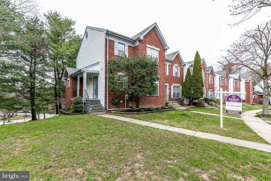 Located in desirable New Town Community, this large end of group townhome has over 2100 sf of living space.  Newly painted and elegant crown moulding throughout, this home has it all.  Large entry from private side front porch to hardwood foyer.  The large living room flows easily to the dining room and eat-in kitchen with stainless appliances.   Slider door to deck.   Large master bedroom with his/hers closets, crown moulding with lighting.  The master bedroom also has a recently renovated en suite bath including granite counters, spa tub and separate shower with heavy glass doors.    Two more large bedrooms and an updated bath complete the second level.  The lower level is fully finished including a large separate laundry room, work room, half bath and large family room with slider to back patio.  Come see this lovely home!