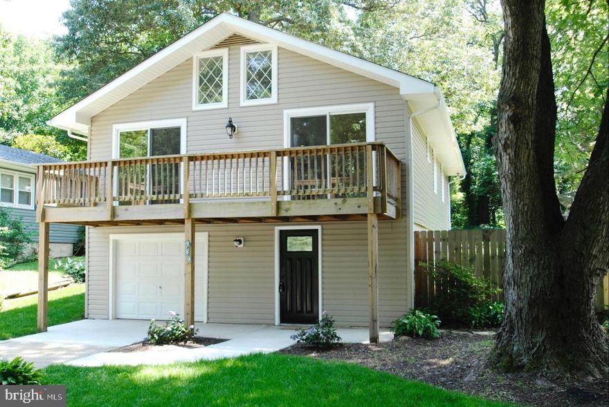 Here is your opportunity to own this charming home in the water privileged community of Cape St Claire. The kitchen, dining and living room is bright and sunny with 2 large sliding glass doors leading to a large deck, cathedral ceilings, and new wood flooring throughout.  The kitchen is updated with granite counters and stainless-steel appliances.   Both bathrooms are also updated.  There is an attached one car garage as well as an oversized parking pad that allows for up to 4 vehicles to park. Beautiful, shaded yard and brick patio area make this a great space to relax and enjoy this home and property. The Cape St. Claire community has some of the best water privileges in the county! Multiple beaches, 3 marinas/docks, boat ramp, playground and community center. Easy commute to Baltimore, Annapolis, DC or the Eastern Shore.