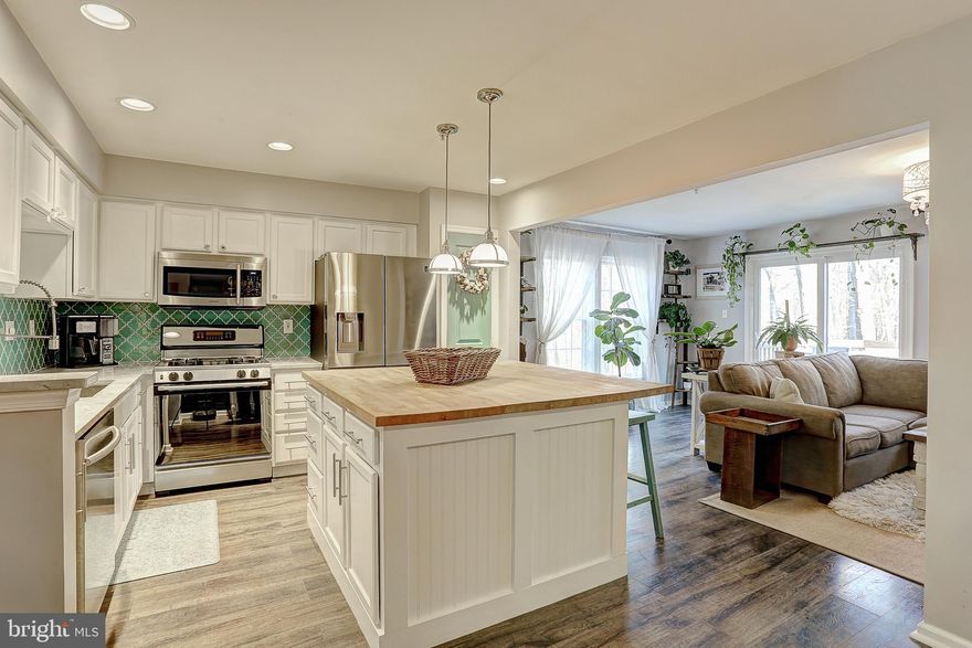 Absolutely perfect end unit backing to miles and miles of parkland. Every last detail has been thoughtfully detailed and upgraded throughout down to the doorknobs and hinges.  Privacy on all sides with lots of natural sunlight. A true gourmet kitchen, making meals and entertaining a breeze.  Gas cooking, custom backsplash, oversized butcher block island, refrigerator 2019. Fabulous family room directly off of the kitchen.  Full three story bump out.  Shiplap walls and all flooring updated throughout the home 2014.  Oversized owner’s suite with a sitting area for you to overlook your private, wooded views and oversized walk-in closet. Totally renovated owner’s bathroom 2016 with a gorgeous glass shower, stone tiling and upgraded fixtures. Recently updated second full bath with custom mouldings. Enormous second bedroom with private access to the full bath.  It truly will not get better than this one.  Roof and gutter helmets 2015, new siding/windows/sliders 2020.  Wood burning fireplace in the lower level, full walk out level, workshop area, and laundry. Minutes to major roads, restaurants, shops, and more. An exceptional home.