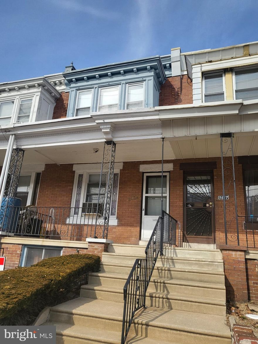 This 3 bedroom, 1 full bath, porch front row has been owned by the same family for over 40 years.  It is being sold in "as is " condition,  however it is livable,  If you are someone who wants to purchase a home and make improvement as you go along, this is the perfect property.  The other features are,  a nice eat in kitchen with access to a rear fenced yard through a storage room.  It also has a full  basement with a laundry room that features a washer and dryer which is included.  There is a room with a working toilet that needs a sink to make it  a complete powder room and you also have access to the rear yard from the laundry room area.  Considering the prices of property today you may want to put this home on your list. If you are a contractor/investor, this is a great investment.  Make an appt. today.
Please note there is a chair rail that is still in the house and will  be included in the sale of the property