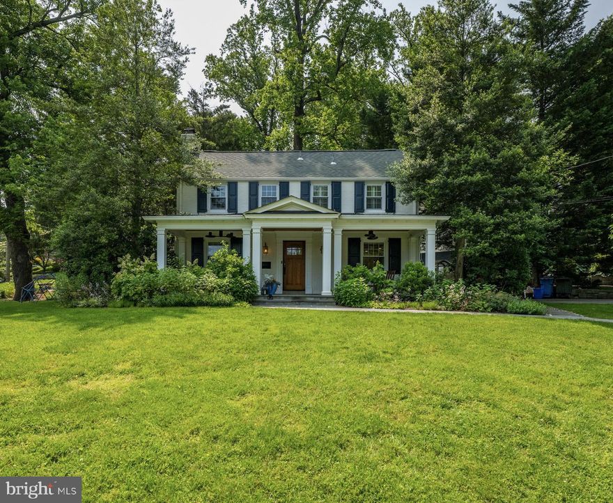 Picture-perfect Colonial in sought-after Wood Acres with welcoming, wide front porch.  The gracious living room with wood-burning fireplace and custom built-ins invites you in.  The updated kitchen features quartz counter tops, new Wolf stove and Bosch dishwasher, bar counter, and a quaint breakfast area. The dining room with wainscoting opens to a light filled sunroom with heated floors. The upper-level features three bedrooms, inclusive of primary suite, and a full hall bathroom. The finished the lower level has a large recreation room with bar area, storage and laundry room.  Numerous updates throughout - windows, appliances, water heater, washer/dryer, interior doors.  Stunning corner lot and private rear entertaining area, complete with fire pit and outdoor kitchen, round out this special home.  Steps to neighborhood park & elementary school, a short walk to Capital Crescent Trail & Westbard Square and and easy access to downtown Bethesda, DC & Virginia.