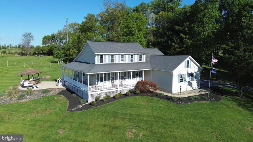 Welcome Home to This custom built Colonial on nearly 2 beautiful acres here in New Windsor, MD. The home is very charming with a unique layout and original hardwood flooring, while the setting is private and the views from the wrap around porch and patio are unmatched! The main level features a primary bedroom, full bath w/ custom shower, and walkin closet.. vaulted ceilings in the great room, skylights, a brick fireplace, granite countertops in the kitchen, formal living/dining room or private office space! The upper level features 3 additional bedrooms with connecting full bathroom. The lower level offers another 770sq ft of finished living space including an exercise room, new LVP flooring, game room, wood stove, and plenty of storage. Step out back and enjoy the scenery from the large patio with a cool drink at the Tiki Bar.. PERFECT for entertaining!.  Notable updates include a recently replaced HVAC, kitchen appliances 2024.  Centrally located between Westminster, Mount Airy, Frederick, and Eldersburg.  Book your showing today!