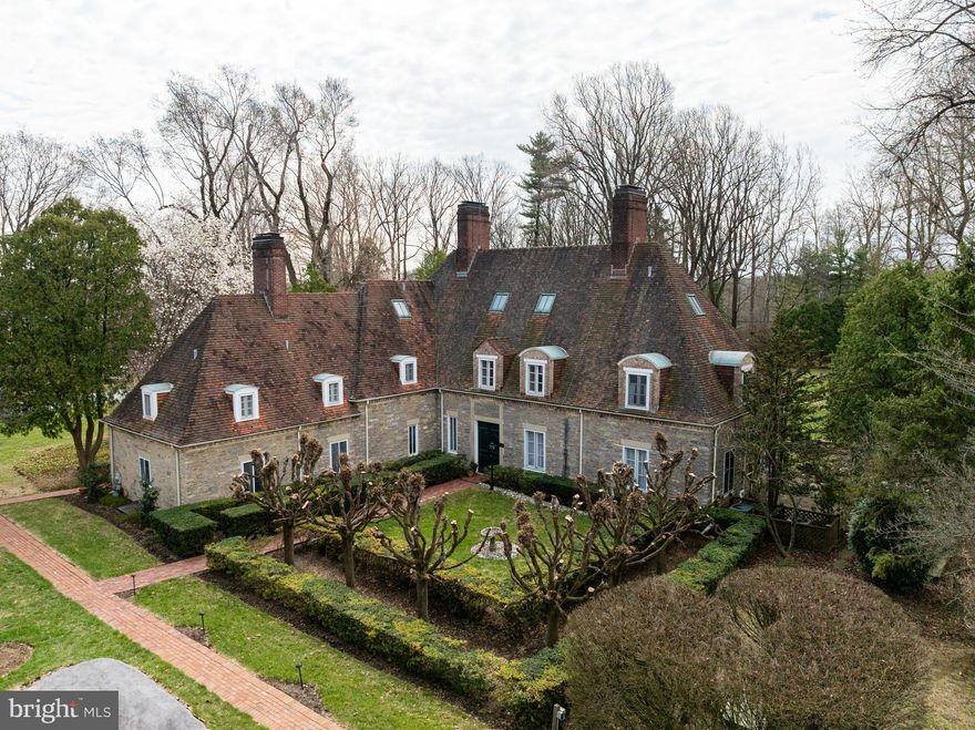 Buy this Twin home and  own a piece of history! Designed and built in 1928 by architect Edmund Gilchrist for the Rush family, this French chateau-style home was inspired by many of the homes found in the Burgundy region of France.  In the early 1990s, the property was acquired - and listed on the National Register of Historic Places - and became the centerpiece of a small charming carriage-home community.  At that time, the mansion was converted to TWO separate residences.  One of these residences is now for sale. this spectacular 3-bedroom, 3.5-bathroom conversion of the historic AUTUN Mansion offers old-world charm and modern convenience. The original mansion has been divided into two large units, each approximately 3,100 sq. ft.  The lovely paneled living room includes built-in bookcases, a wood burning fireplace, and three sets of French doors opening onto a terraced rear yard.  Please watch the video which has aerial views of the grounds to get a feel for the outdoor space.  The open floorplan kitchen opens to a large dining/great room featuring a gas fireplace, powder room, and French doors, with a small wet bar between the dining room and living room.  Original herringbone hardwood flooring and beautiful millwork adds to the home's historic appeal, complimented by high ceilings throughout. Each large bedroom comes with an en suite bath, and its own wood burning fireplace. The 3rd bedroom, as referred in the public records, is currently a loft and can be easily converted to a private bedroom if needed. The home features five fireplaces throughout its 3 levels and and a second-floor stackable washer and dryer.  This enchanting property features hidden passages that add a touch of mystery and excitement. Rotate one of the bookcases to reveal a passage way into the large dining/great room which is actually a small wet bar built with the house during Prohibition.  On the second level, beneath the main staircase, is a secret hideaway perfect for children or a cozy Harry Potter-inspired nook.  A one-car detached garage is conveyed with the home and has a separate tax Id.   That can be a storage source and an unfinished basement provides additional storage. The home is equipped with 2 furnaces, one in the basement that controls the main level,  and another on the 3rd level that controls the 2 upper levels. As far as the Seller is aware, since it is on the Register of Historic Homes, owners are not allowed to make any changes to the exterior of the home. Buyers to verify any info they want regarding this before purchase.  Outdoor spaces include a patio, terraced lawn, and an expansive courtyard which is maintained by the HOA. Autumn Way is a private street managed by the HOA. The community is a total of 10 Twin homes, this home and the adjoining twin are the original 1928 converted mansion.  The remaining 8  twin homes  in the community, were built in the late 1980s or early 90s.  The Home is being pre-inspected and the report wil be shared with interested Buyers.  Perfect for busy lifestyles, this home offers private and convenient living amongst the bustle of West Whiteland township.  The Exton area is known for its convenient location near major highways and train lines, facilitating SEPTA commutes to Philadelphia and Amtrak visits to NY, DC and other top Northeast cities. Access to desirable West Chester schools, beautiful parks and diverse job opportunities, shopping centers like Exton Square Mall and the Main Street at Exton open air shopping area. Just minutes away, you'll find the vibrant West Chester downtown area, brimming with charm and activity, unique boutiques & shops, and plenty of diverse restaurants where there's always something new to explore. The lively events throughout the year add to the appeal, making West Chester a wonderful place to call home.   Please respect the owner's and the neighbor's privacy if you are driving by the property.   Schedule your showing today!