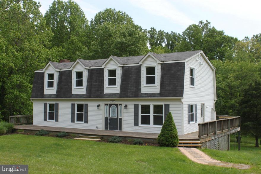 YOUR OWN PIECE OF PARADISE WITH THIS DUTCH COLONIAL W/5 BR 3 1/2 BATHS ON A 3.26 ACRE LOT WITH A STREAM!!! THIS HOME HAS BEEN TOTALLY RENOVATED DOWN TO THE STUDS AND OFFERS A LG KITCHEN W/NEW GRANITE COUNTERS, 42" CABINETS, SS APPLIANCES* HARDWOOD FLRS * REPLACEMENT WINDOWS/DOORS * NEW FURNACE * LG LL FAMILY RM W/FIREPLACE, WET BAR & WALK-OUT TO THE PATIO.  ALSO INCLUDES A BARN FOR THE HORSES!!