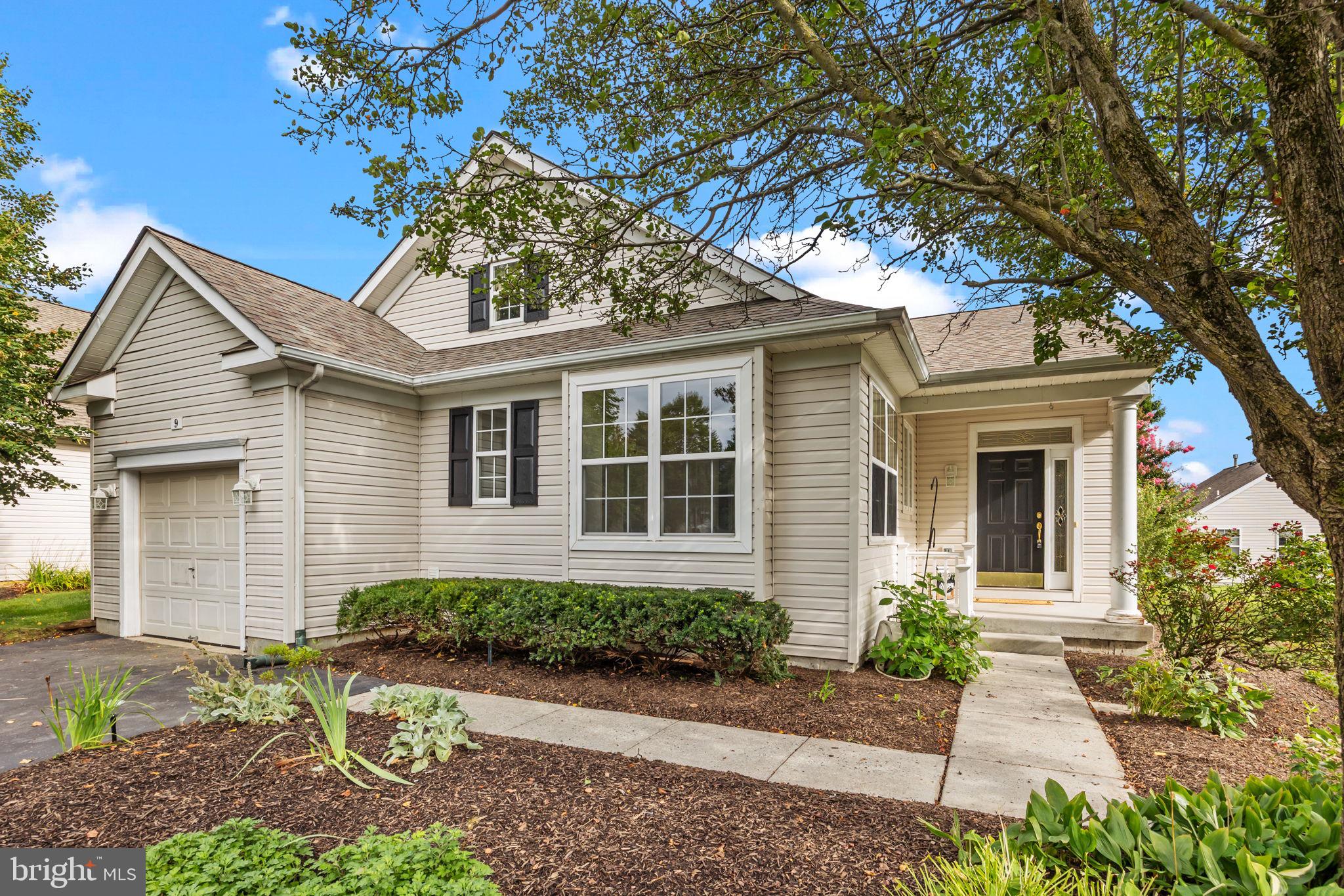 Welcome Home! This Bartram Model single-family home in the popular 55+ community of Flowers Mill is ready and waiting for you! Upon entering from the covered porch, your eye will immediately be drawn to the new flooring that flows throughout the main living areas and bedrooms. The combination living room/dining room with vaulted ceilings creates an open, airy feel, perfect for hosting family and friends. Beyond the great room, you’ll find a bright sunroom that overlooks a large, low-maintenance composite deck surrounded by beautiful landscaping. This floor plan is ideal for those who love a spacious eat-in kitchen, complete with ample cabinet and counter space, new granite counters, stainless steel appliances, and a pantry. On the main floor, you’ll also find the large primary bedroom with a walk-in closet and adjoining bathroom. Rounding out the main level are a second bedroom, a second full bath, a laundry room, and convenient garage access right off the kitchen, making unpacking groceries a breeze. Don’t miss the functional finished basement featuring a large open space with brand-new carpeting, two bonus rooms perfect for guests or a home office, two additional storage rooms, and an up-to-code egress window. Notable updates include new flooring and carpets, freshly painted main floor, and new garage door opener. Residents of Flowers Mill enjoy a vibrant lifestyle with a recently updated clubhouse, indoor and outdoor pools, tennis and pickleball courts, bocce, walking trails, and a calendar full of community events.
