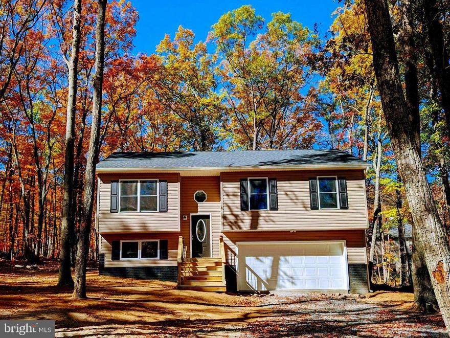 Brand new home ready for you to move in! This newly constructed home is on a wooded half acre lot in a quiet mountain-side neighborhood close to Winchester. On the upper floor you'll find kitchen with brand-new appliances and a large stainless steel farm sink, living room, the primary bedroom with en suite bathroom, two more bedrooms and a full bathroom. Downstairs is a den and bonus room, the laundry room and a two-car garage.