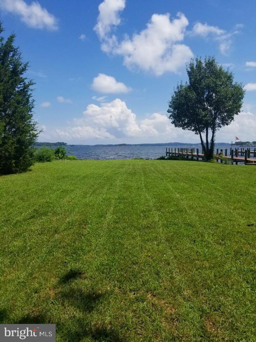 .39 Acres Of Spectacular Waterfront Property! Sunrise View Of The Magothy River. Large Level Lot With Bulkhead And Private Sandy Beach. Biggest Lot on the Street! Cozy Three Bedroom Two Bath Home Is Very Liveable and sold AS IS. Public Water and Sewer.  Upgraded Electric Panel.