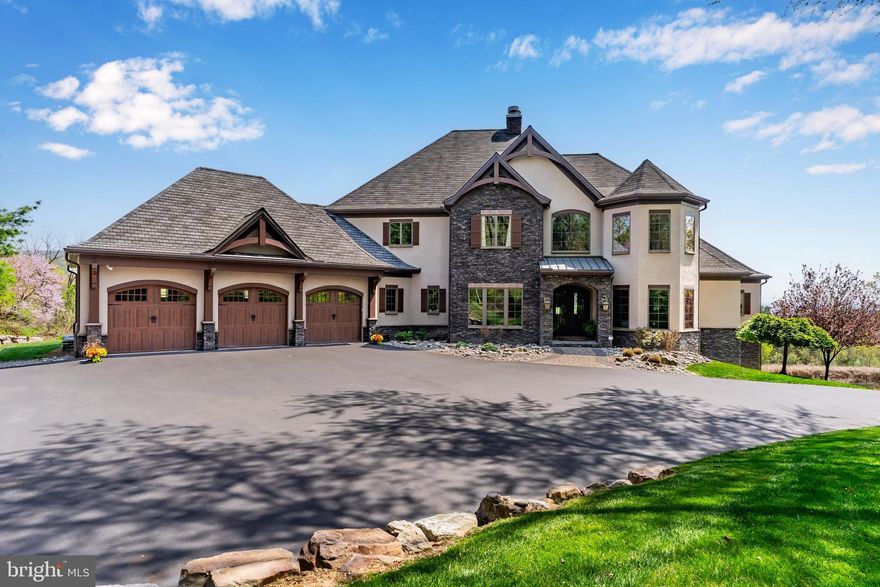 Welcome to this magnificent Roland built home with stunning views!!  This home boasts a spacious floor plan with approximately 6700 square feet of finished living space,  filled with expert craftmanship and luxurious details. Upon entering, you are greeted by a curved staircase in the 2-story foyer, stone archways, solid wood doors, beautiful tile work, and professional land and hardscaping.
The family room is an entertainer’s delight, featuring a vaulted, beamed ceiling, a stone 2-sided fireplace, and formal dining room, both with golf course views and hardwood flooring. The large chef-inspired kitchen is sure to please, with granite countertops, a center island with a veggie sink and breakfast bar, cooktop with pot filler, stainless steel appliances, and a dining area with golf course views.
The first-floor primary suite offers elegance and comfort with crown molding, a tray ceiling, a large walk-in closet, a balcony, and a bath with dual sinks and a luxurious walk-in tile shower. Additionally, an office, half bath, dog shower, and laundry room with sink complete the main level.
Heading upstairs, you will find three additional bedrooms, each with a full bath, laundry chute, and a loft area. Outdoor living is enhanced by the composite deck and stone patio that overlook the heated saltwater infinity pool and fire pit, providing breathtaking golf course, mountain, and river views.
The new basement buildout expertly completed by Rowland Builders features a large family room with fireplace and a full gym area.
Other features include a side entry 3-car garage. 
The home’s convenient location provides easy access to shopping and major highways.