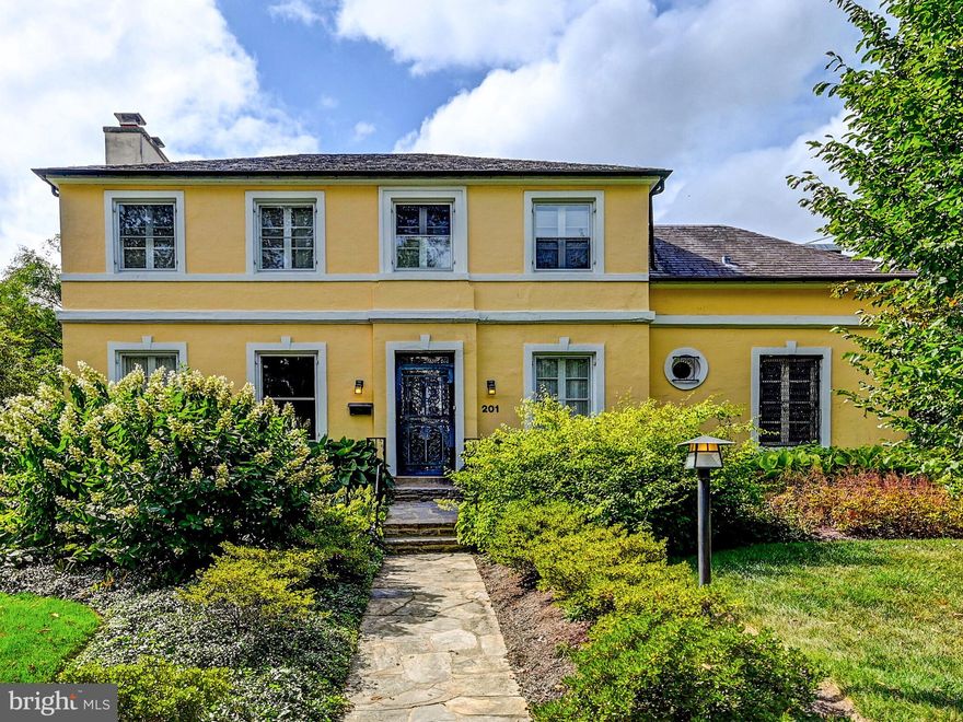 Built in 1929 and located in the highly coveted 200 block, 201 Saint Dunstans Road is a wonderful place to call home in Historic Homeland.  Loved and very well cared for by the current owners for almost 35 years.  Less than one block to the picturesque lakes of Homeland, there is a special feeling of beauty and history in this community.  Featuring an oversized Living Room and Dining Room that you would find in a larger home makes this house wonderful for entertaining, and every day living.  A highlight of this house is the custom designed basement, and The Floating Stair, that was featured in Chesapeake Home magazine in 2007.  The basement is completely waterproofed and could be used in any number of ways, but is currently used as a studio and workspace / home office.  The second floor of the home features three bedrooms and two full bathrooms.  Both bathrooms and the kitchen were completely renovated about 20 years ago.  The 36 inch Thermador oven is a year old, and the gas boiler was installed in 2023.  CAC on all three levels.  Sited on a corner lot, the rear yard is a fully fenced garden paradise.  Two car detached garage and newer slate roof maintained with annual inspections by Fick Bros.  The wood burning fireplace in the LR works beautifully and is being sold as-is.