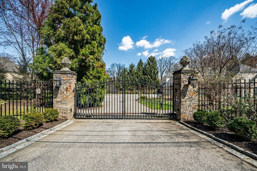 A rare find on one of the most exclusive and hidden streets in the Philadelphia area, just a stone’s
throw away from Gladwyne’s charming village center and minutes to central Philadelphia. 225
Maplehill Road is set on 3.79 acres of natural beauty and boasts 7,100+ sq ft of living space that
combines gorgeous views of a nature preserve with the ultimate in privacy, luxury and
convenience.
Follow the red brick path past an elegant water fixture to the front door, and you will enter the
high-ceiling foyer, complete with marble floor. To the right of the foyer is a beautiful library with
floor-to-ceiling cherrywood shelves, built-in workstation, and a sunny reading nook with bay
window. The living room, which opens from the library, focuses on a French-style stone fireplace
with mantel (gas flame), with bright floor-to-ceiling windows on either side. To the left of the
foyer is a dining room with large windows, tasteful built-in display alcoves with shelves,
gorgeous crown molding, and chandelier. An adjacent butler pantry, downstairs bar, and wine
cellar make entertaining easy, as does the large kitchen, which features granite countertops,
commercial-grade stainless steel appliances, a double sink, and a built-in desk nook with
concealed printer cabinet. French doors in the kitchen open onto a spacious Brazilian hardwood
deck.
On the corner of the living room and kitchen is a warm and inviting sunroom with matchless
views of the garden—which was lovingly planted with rosebushes, peonies, and over a hundred
trees by the previous owners—and of the majestic trees and gently sloping protected land of the
nature preserve. Nature surrounds you in this room, which is the ideal space to watch birds or
occasional visits from families of deer just past the fence.
A stunning feature of this house is the sun-drenched first floor master bedroom, with two
ensuites and walk-in closets as well as independent deck access. The first floor is complete with
a mud room, closets and laundry room with a brand-new washer and dryer powerful enough for
all your laundry needs, as well as utility closets, cabinets, and a three-car garage.
The second floor has four sizeable bedrooms and two bathrooms, along with several dedicated
storage rooms. Each room provides beautiful views off different sides of the house, and a
spacious landing, doubling as a sitting area, overlooks the foyer.
The lower level has a large, sunny central area with a gas fireplace and wet bar that can function
as a sitting area, home office, or combined space. There is a dedicated gym with a custom
ventilation system, mirrored walls, and shock-absorbing rubber-tile flooring, right next to a
bathroom with a high-pressure shower. Further amenities include a generous guest or in-law
suite, two sets of French doors stepping directly out onto the brick patio and garden, wine cellar,
and radiant floor heat. Uniquely, this level also contains a state-of-the-art compact library system
with rolling stacks like those commonly found in law offices and university libraries.
All in all, this is a quality architect-designed luxury house of the highest quality, in a tranquil,
peaceful, and uncrowded setting, the beauty of which is unusual even for Gladwyne. Homes on
this secluded street do not appear often. Schedule your tour to see and enjoy!