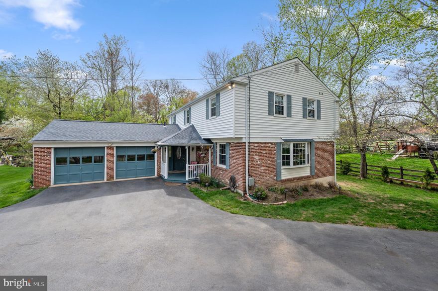 Set on a scenic corner lot in one of Radnor Township’s most sought-after
neighborhoods, this charming, light-filled colonial offers an unbeatable location
just blocks from the Radnor Trail, top-rated schools, parks, playgrounds and more.
A circular driveway leads to the distinctive front porch. Inside, you’ll find
hardwood floors, custom millwork and elegant moldings throughout, along with
multiple living and entertainment areas and a seamless flow. Off the foyer sits a
spacious front living room with a beautiful bay window, tasteful paneling and chair
rail. An enlarged cased opening frames the bright and cheery dining room
beyond—perfect for gatherings of any size and style! The heart of the home—a
sprawling open-concept kitchen-family room—lends itself to effortless living and
entertaining. The skylit kitchen features a new gas cooktop, double wall ovens, a
center island with seating and warming drawer, closet pantry and plentiful
cabinetry. Just steps away, the breakfast area overlooks the wooded backyard, while the adjacent family room boasts a gas fireplace flanked by custom built-ins. A rear door leads to a lovely sunroom that brings the outdoors in with expansive views of the lush backyard. From there, step onto the spacious
Trex® deck with separate areas for lounging and dining al fresco. Upstairs,
hardwood floors flow through the hallway and bedrooms, including the primary
suite with dual closets and tiled ensuite full bath. Four additional
bedrooms—two with custom built-ins—offer flexibility for family, guests or work-
from-home needs, while a hallway bathroom and laundry closet add ease and
convenience. Back downstairs, the finished lower level provides versatile space for
game nights, movie marathons, home exercise and play. Outside you’ll find nearly
an acre of greenspace, along with sidewalk-lined streets that lead to many popular
destinations, including Bo Connor Park, Mill Dam Swim Club, Radnor Memorial
Library and the shops and restaurants of downtown Wayne. For year-round
convenience and peace of mind, this home boasts an attached two-car garage and
whole house generator. Schedule your private showing today and discover all this
welcoming home and walkable neighborhood have to offer!