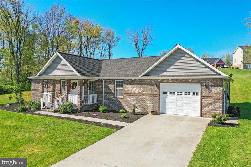 Welcome to your dream home in the desirable Harvest Hills subdivision of Romney, West Virginia! This beautiful ranch-style home offers the convenience of single-level living with an immaculate interior and attractive landscaping that will surely impress.  As you approach the home, you're greeted by a charming covered front porch, perfect for relaxing evenings spent on rocking chairs, savoring the tranquility of the neighborhood.  Step inside to discover an excellent floor plan that seamlessly transitions from the spacious living area to the open kitchen, ideal for entertaining guests or simply enjoying family time. The kitchen boasts ample counter space and modern appliances.  Beautiful T&G on the vaulted ceilings give this home a dramatic feel.   This lovely home features three generously sized bedrooms and two bathrooms, providing comfortable accommodation for the whole family. Additionally, there's a separate laundry room with pantry and utility sink for added convenience.  For those with storage needs, the attached one-car garage is oversized and equipped with cabinets and a work counter, offering plenty of space to store tools, equipment, and more. Interior and exterior access doors for convenience.  Plus, there's a pull-down attic providing additional storage options.  This home showcases modern construction and design elements, ensuring both style and functionality.   Conveniently located near shopping centers, dining establishments, and schools, this home offers easy access to everything you need for daily convenience and enjoyment.  Don't miss out on the opportunity to make this meticulously maintained and thoughtfully designed home your own slice of West Virginia paradise!