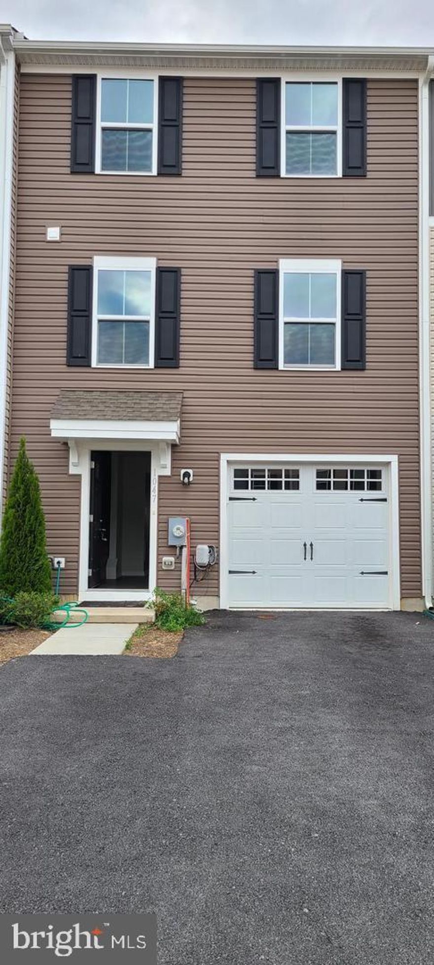 Near New Townhome: Just  3 years old. 1 Car Garage with garage door opener. 3 car additional parking in driveway. Pasture Views from rear of home. Walkout Basement. 3 bedrooms. 2 Bathrooms. Stainless Steel Appliances. BIG Single Bowl, deep sink. Stainless Steel Refrigerator, Dishwasher, Cooking Range. Instant hot water heater will save a lot on utility bills, since water will only be heated on-demand. Serene pasture view from rear of the home. Near- New High quality Carpet, with high quality 8 Lb. under-pad has been recently installed on Oct. 29, 2024. Community is only 3 years old. Community has lots of open spaces.