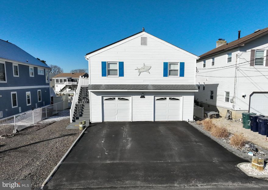 Searching for that special location! Your search could be over. Home is located on the Little Egg Harbor side of the Tuckerton Creek. that leads directly to the open bay for all of your boating pleasures. On the way out there is a marina so you can fill up with gas, If you are into birds this is your spot. Get on your kayak and travel along the banks to see egret's herons and many other species. Home offers 3 bedrooms 1.5 baths a 3-season room of the back that leads onto a large deck. This is where the fireworks will be visible along the skyline on the 4th of July. Vinyl bulkhead, a floating dock and a stationary dock. Full Garage under the home offers tile flooring, 3 overhead garage doors and a man cave in the back. Mr. Clean occupies this space. Welcome Summer of 2026