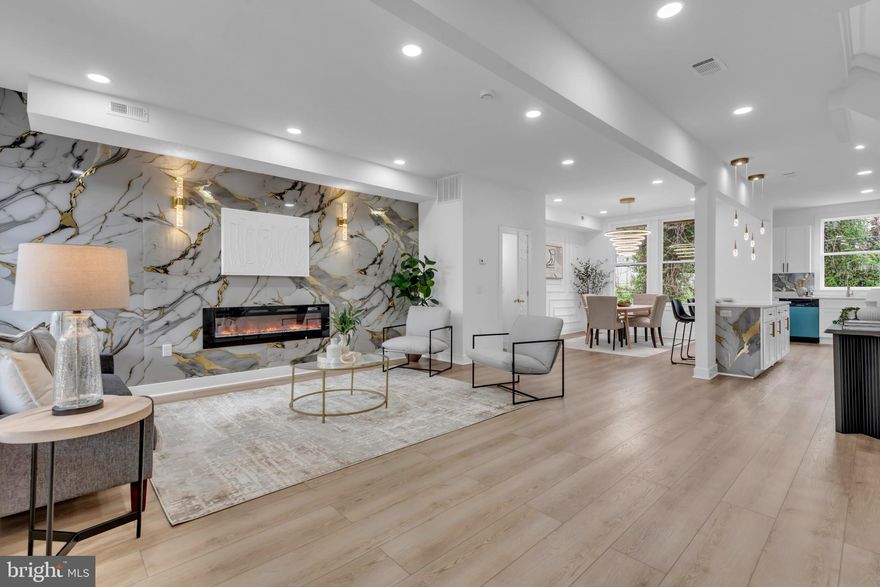 This beautifully rehabbed 4-bedroom, 2.5-bath rowhome offers the perfect blend of modern style and functional living. An open, light-filled floor plan showcases stunning flooring, recessed lighting, and high-end finishes throughout, including statement tile, floating shelves, stylish cabinetry, and two electric fireplaces.

The kitchen features stainless steel appliances and flows seamlessly into the main living areas. Upstairs, spacious bedrooms are paired with an updated, spa-inspired bathroom, while the finished basement provides flexible space for a home office, guest room, or additional living area and a corresponding full bathroom. 

Recent updates include HVAC (2026), hot water heater (2026), windows (2026), flooring (2026), and roof (2026). This home has been beautifully updated. With a prime location near shopping, dining, and commuter routes.