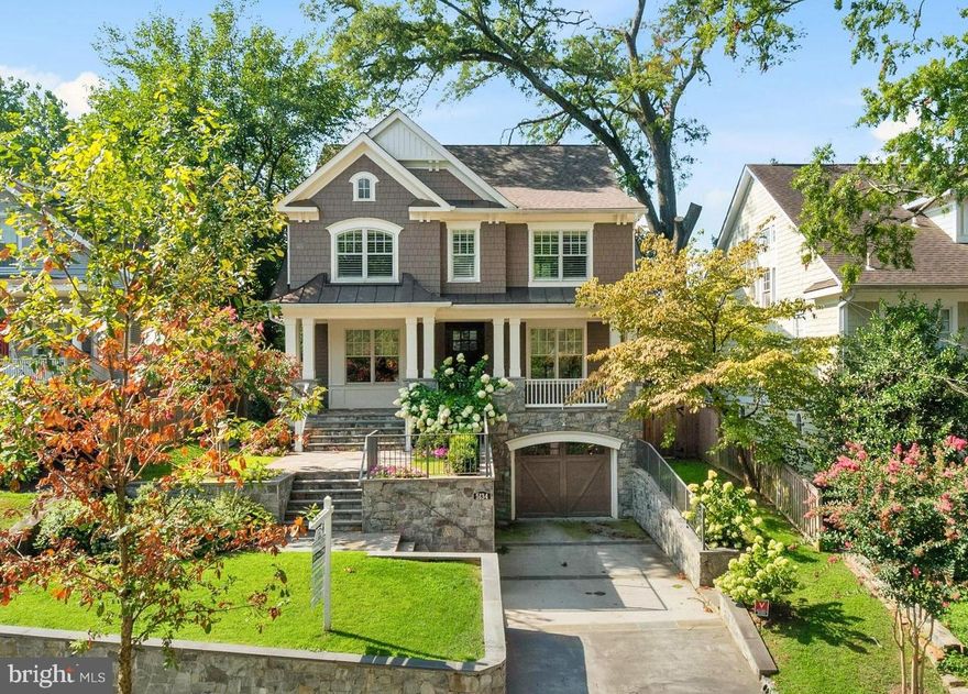 Welcome to 5134 Cathedral Ave NW! This pristine & expansive home spans approximately 5,200 square feet over four finished levels and features gleaming hardwood floors, detailed millwork and high ceilings throughout. Meticulously built in 2016, this exquisite residence still feels brand new! The first floor features a wonderful open concept family room/kitchen with a fireplace, an adjoining screened-in porch with second fireplace, formal living and dining rooms, butler's pantry and powder room. Above, the gorgeous primary bedroom suite has its own balcony, two walk in closets, and a spa-like bathroom with two vanities, soaking tub, and heated floors. Three additional bedrooms, two additional bathrooms and the laundry room complete the second level. The third floor has a fifth bedroom and a full bathroom. The lower level includes a large recreation room with a gas fireplace and ample space for a family room and an art studio or gym, a sixth bedroom, additional full bathroom, mud room and one car garage. Outside, enjoy the plunge pool & hot tub complete with waterfalls, beautiful landscaping and hardscaping. Additional features include built in speakers, security system, high end finished and  fixtures, and so much more... This home is the home you have been waiting for in Kent!