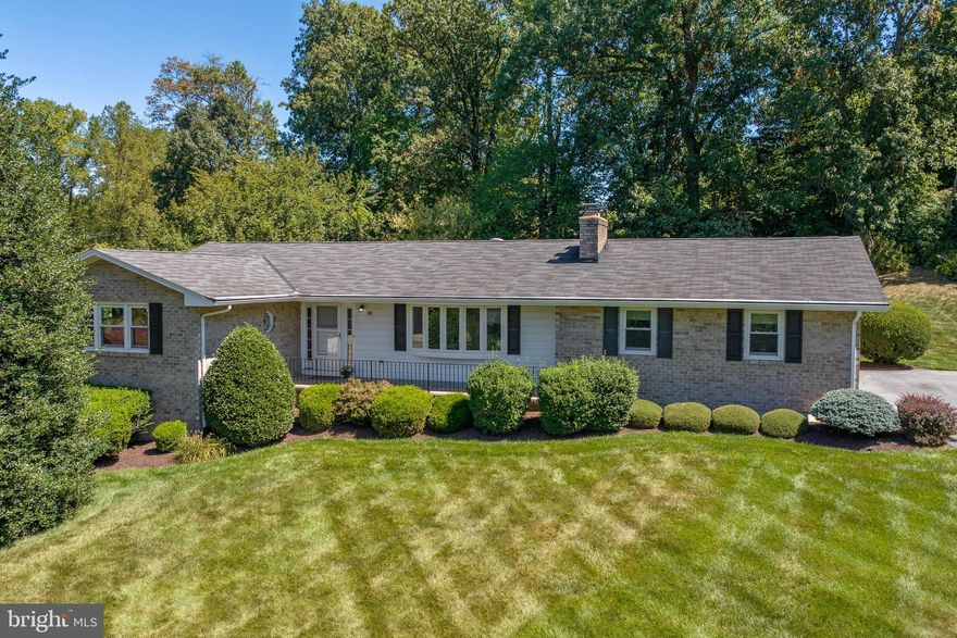 Sun Open house cancelled*Seldom available all brick rancher in sought after Winchester park! Enjoy the best that single level living offers. Meticulously maintained, spacious brick to grade L shaped rancher built by the Hoffman brothers.  Be captivated by the  cul-de-sac location with sunset views, and a park like rear yard fringed by mature trees.  This three bedroom 2 1/2 bath rancher has 2 brick woodburning fireplaces,  hardwood floors throughout most of the main level, new carpet in the DR, hall and den (‘23), an updated kitchen with stainless steel appliances & updated baths with ceramic tile. The spacious primary bedroom affords lots of natural light and has an attached full bath with a shower. The hall bath boasts dual vanities, ceramic tile surround and solid craft mark cabinetry. A spacious den adjoins the kitchen and oversized, one car garage with built-in cabinetry as well as main level laundry (washer-‘22), )and a half bath (a possible In-law suite with its own separate entry?). Dual pane insulated windows throughout(‘09) dual pane, insulated slider  door (‘12) insulated steel front entry door with smart lock technology(‘22) and insulated garage door w openers(‘11)., 5 panel insulated bay window(‘12) faces westward for spectacular sunset views, soffits,gutters and fascia (‘09), A walk up attic for easy, off-season storage. The lower level has a finished rec room with a wood-burning fireplace and almost 1200s.f. of additional unfinished space to finish as you like. Insulated crawl space beneath den (‘23).  It also has  a connecting stair walk out to the gently sloping expanse of rear yard oasis. FYI-The house is heated and cooled by a heat pump but retains baseboard heating to customize each room if you wish. As an added convenience the Seller has pre paid 2024’s trash with Hughes trash service. Awesome location outside city limits, nearby farmers markets, AG center activities, Hoffman’s ice cream, shopping, restaurants and farm museum festivities.