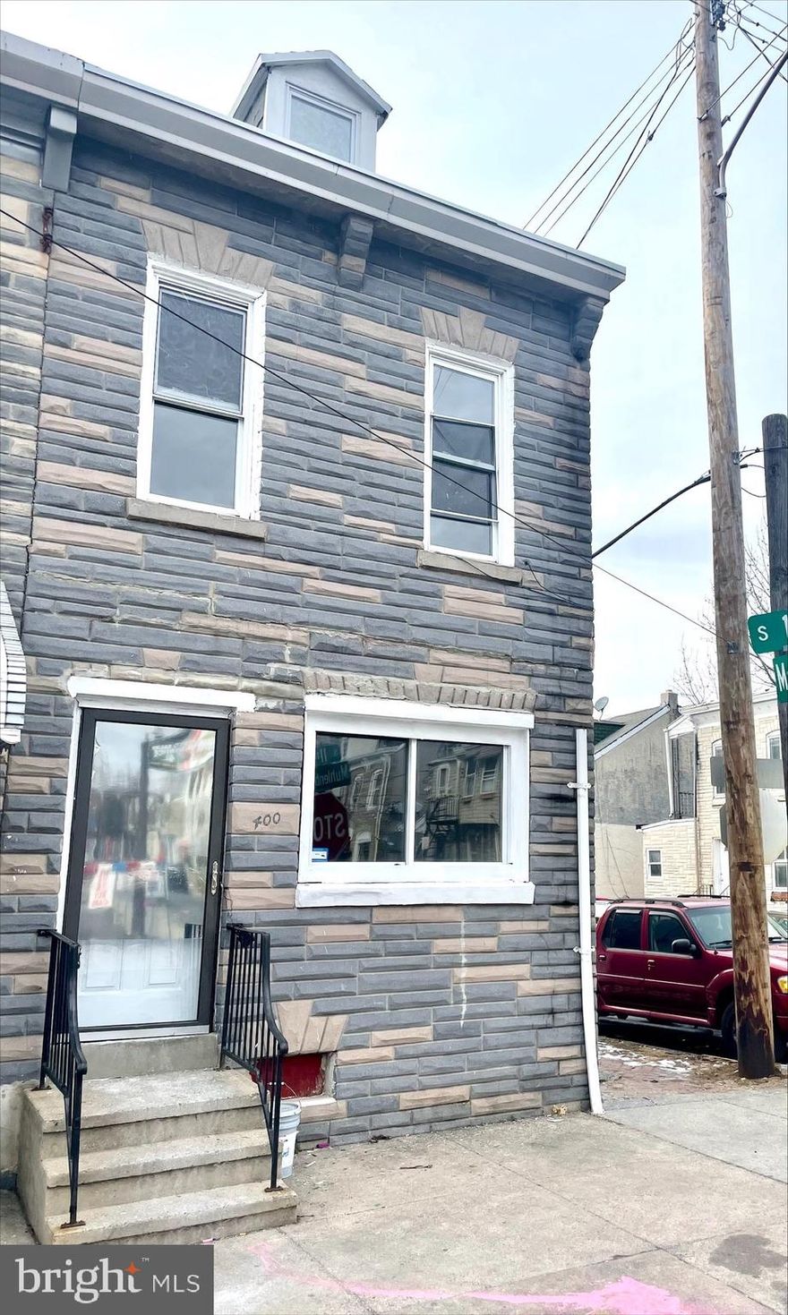 Large end of row, 4 bedroom, 1.5 bathroom.  Tile floors throughout the expansive 1st floor, from the living room to the first floor laundry room.  2nd floor features 3 bedrooms and full bathroom, and all new floors. On the 3rd floor you have the 4th bedroom.  Freshly painted in neutral colors throughout the entire house.