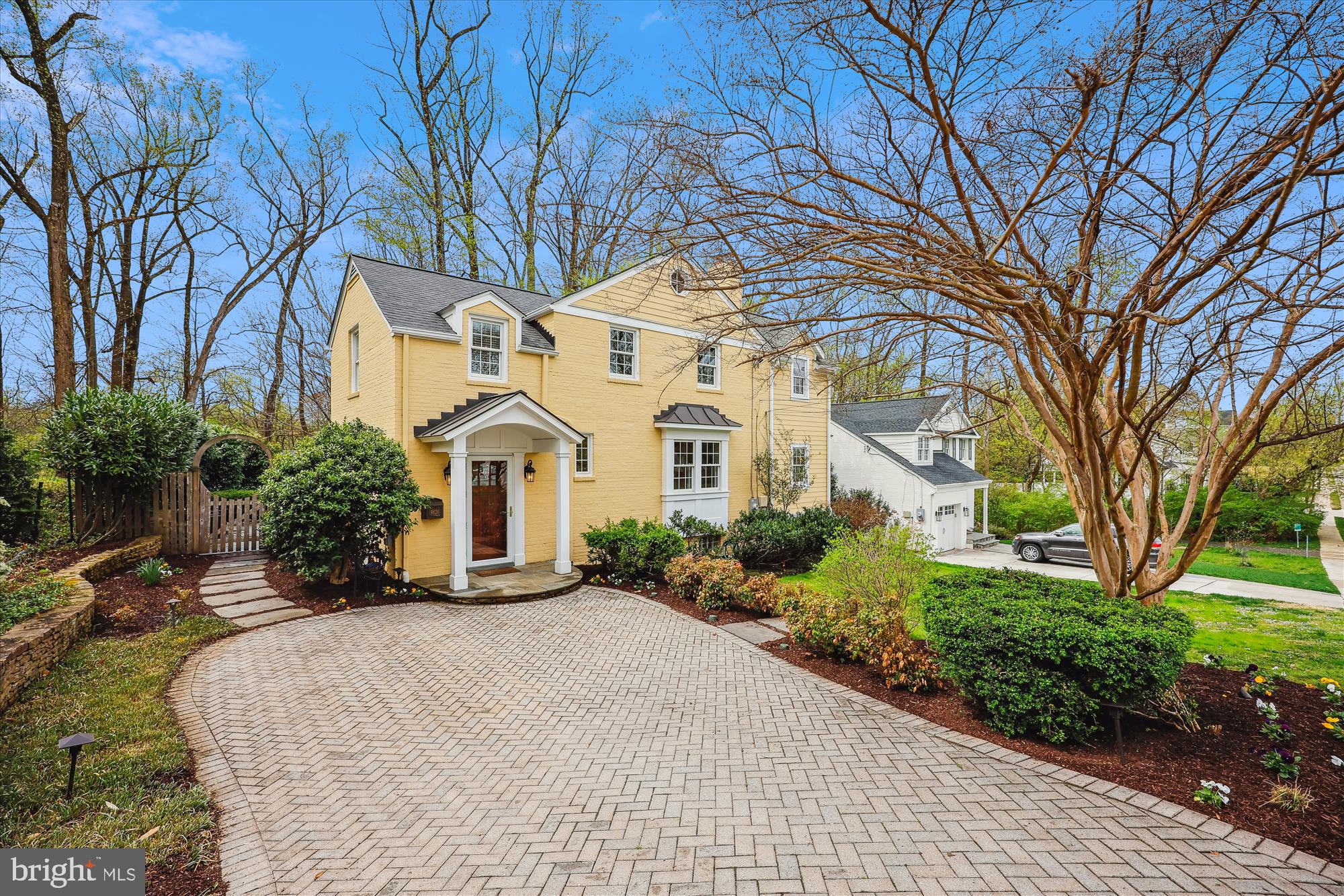 OPEN HOUSE CANCELLED. Renovated with artistic vision and designed for modern living, this exceptional home offers timeless curb appeal and every amenity for comfort, entertaining, and recreation. From the herringbone-patterned driveway to the inviting front portico, the classic brick and siding exterior sets the stage for a thoughtfully designed interior.
The home opens to a custom entry/mudroom—every organized household’s dream—featuring floor-to-ceiling stacked shelving, charming window seats, built-in drawers, and hooks. Finished with slate flooring and a convenient powder room, this stylish and functional space also provides access to the backyard, setting the tone for the home’s seamless blend of luxury and practicality.
A landing leads to the living room, highlighted by one of the home’s three fireplaces. The stunning kitchen is a chef’s dream, featuring rich, polished cabinetry with crown molding, rounded open shelving, and glass-front doors—perfect for decorative displays. Ample storage and expansive counter space make this kitchen as functional as it is beautiful. A pass-through opens to the dining area and an adjacent light-filled home office or craft room—an ideal flex space adaptable to various needs.
Glass pocket doors connect the kitchen to a warm and inviting family room with floor-to-ceiling windows, custom built-ins, and a gas fireplace. Just beyond, an expansive screened-in porch boasts a brick wood-burning fireplace, slate flooring, and a beadboard ceiling, creating a serene, all-season retreat. The porch flows effortlessly into a flagstone patio, a fully fenced backyard, a spacious detached shed, and even a basketball court for friendly competition.
Upstairs, three spacious bedrooms and two full baths await. The primary suite includes two closets and a beautifully renovated ensuite bath with a marble-topped vanity, a separate shower, and a dramatic vaulted ceiling. The additional bedrooms are equally inviting, including one with a stylish board-and-batten accent wall. The hall bath features a relaxing soaking tub.
The lower level continues the theme of easy living with durable luxury vinyl flooring, a laundry room, a full bath, and a large insulated storage room with power and lighting. Every detail has been thoughtfully designed for modern convenience, from Elfa closet systems to a 200-amp heavy-up electrical system and an outdoor car charging port.
Located in the heart of Parkwood, with its beautiful tree-lined streets and sidewalks, this home backs to the park and the biking and hiking trails into Rock Creek Park. It is moments from the vibrant Kensington town center, has easy access to commuting routes, and is located near excellent schools. For the buyer seeking their perfect forever home, this checks every box!
