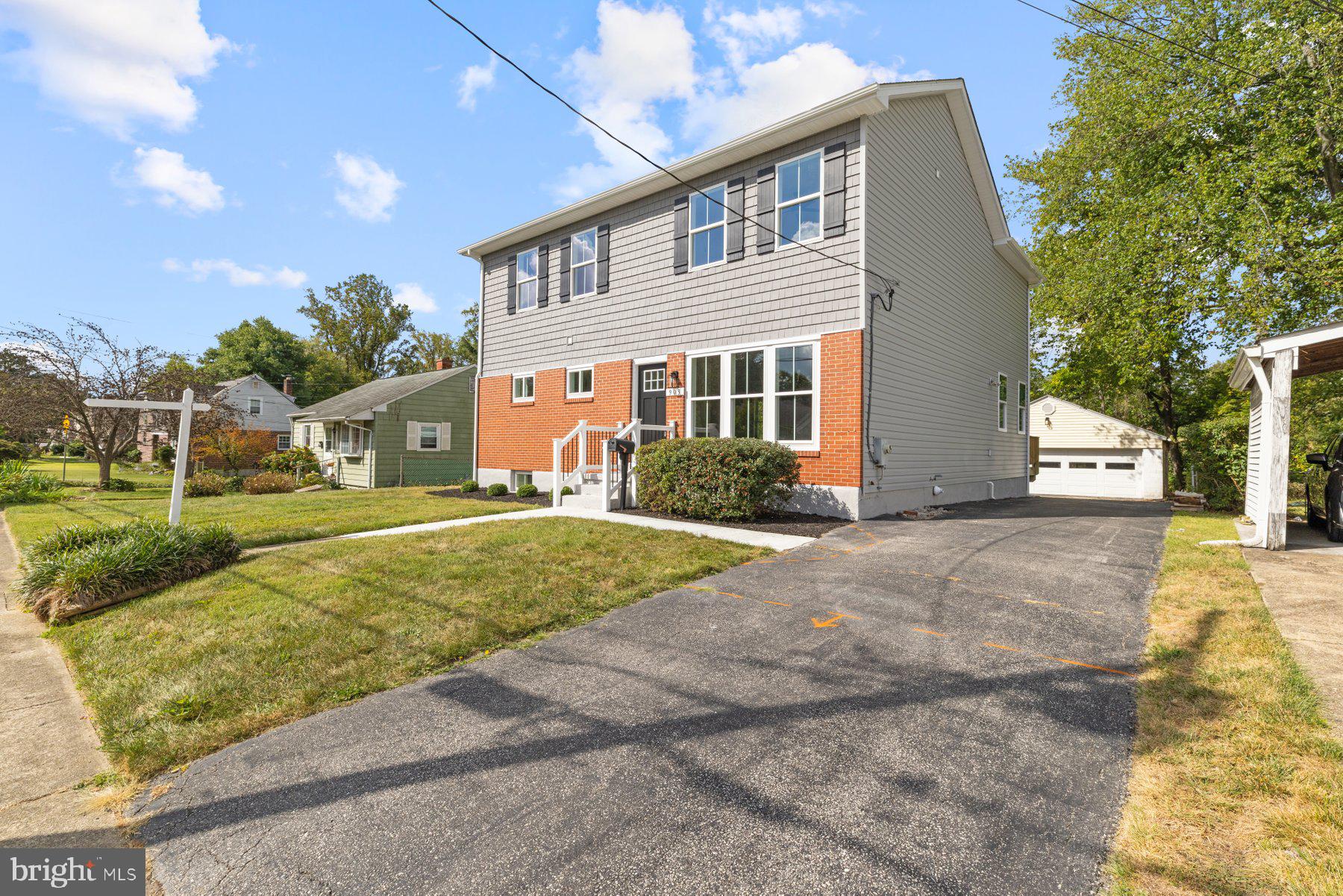 Completely remodeled with massive second story addition on quiet dead end street! Pull into the driveway alongside the beautifully landscaped front lawn and edged beds, make your way to the front door, and step inside your new home. Step into a home with tons of natural light, luxury light fixtures, recessed lighting, LVP flooring, and additional upgrades throughout. The main floor living space offers an open concept living room, stunning kitchen, a bright dining area, a family room, and a mudroom. The family room features a vaulted ceiling and a gas burning fireplace with a floating wood mantel. The kitchen boasts plenty of cabinets finished with crown moldings including a double pantry closet, stainless steel appliances including a six burner slide in gas range, sleek quartz countertops with a beautifully tiled backsplash, a deep stainless sink under a window, and a large island with pendant lights and breakfast seating. The main floor also offers a first floor bedroom with a newly remodeled full bath, and the mudroom with two custom built benches. On the second floor are two sizable secondary bedrooms both with oversized closets, a newly remodeled full bath, and an owners suite. The primary boasts a large room with a spacious walk-in closet and a private en suite featuring a double sink vanity, a deep soaking tub, and a large walk-in shower. The lower level is finished offering you additiional carpeted living space, storage, and laundry. From the mudroom or the sliding doors in the breakfast room, step outside onto a newly constructed wood deck that overlooks a yard filled with green space, a detached two-car garage, and plenty of room for entertaining family and friends. This home is move-in ready, ideal for any new homeowner, and is located in close proximity to shopping, restaurants, and commuter routes.