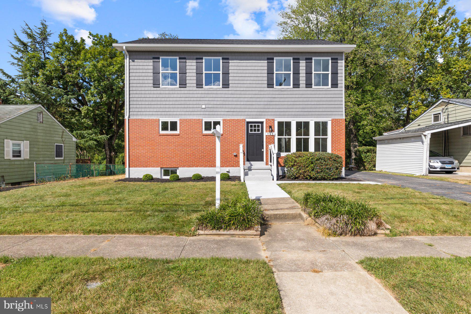 Completely remodeled with massive second story addition on quiet dead end street! Pull into the driveway alongside the beautifully landscaped front lawn and edged beds, make your way to the front door, and step inside your new home. Step into a home with tons of natural light, luxury light fixtures, recessed lighting, LVP flooring, and additional upgrades throughout. The main floor living space offers an open concept living room, stunning kitchen, a bright dining area, a family room, and a mudroom. The family room features a vaulted ceiling and a gas burning fireplace with a floating wood mantel. The kitchen boasts plenty of cabinets finished with crown moldings including a double pantry closet, stainless steel appliances including a six burner slide in gas range, sleek quartz countertops with a beautifully tiled backsplash, a deep stainless sink under a window, and a large island with pendant lights and breakfast seating. The main floor also offers a first floor bedroom with a newly remodeled full bath, and the mudroom with two custom built benches. On the second floor are two sizable secondary bedrooms both with oversized closets, a newly remodeled full bath, and an owners suite. The primary boasts a large room with a spacious walk-in closet and a private en suite featuring a double sink vanity, a deep soaking tub, and a large walk-in shower. The lower level is finished offering you additiional carpeted living space, storage, and laundry. From the mudroom or the sliding doors in the breakfast room, step outside onto a newly constructed wood deck that overlooks a yard filled with green space, a detached two-car garage, and plenty of room for entertaining family and friends. This home is move-in ready, ideal for any new homeowner, and is located in close proximity to shopping, restaurants, and commuter routes.