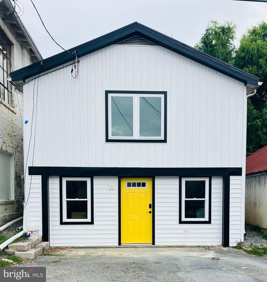 Charming, modern and full of character.  158 W Walnut Street, a gut-remodel in 2022, offers new construction piece-of-mind on a cute, private lot in the borough with off-street parking.  This property was a commercial structure that was converted to residential in 2021 with all new framing, mechanicals (including spray foam insulation), windows, doors and interior/exterior finishes.  There is luxury vinyl plank throughout, the bedrooms include ceiling fans and the open-concept living area includes a modern kitchen and exposed beam ceilings.  All appliances (including washer/dryer) stay with the property.  The exterior features a private patio, a small yard and two off-street parking spaces.