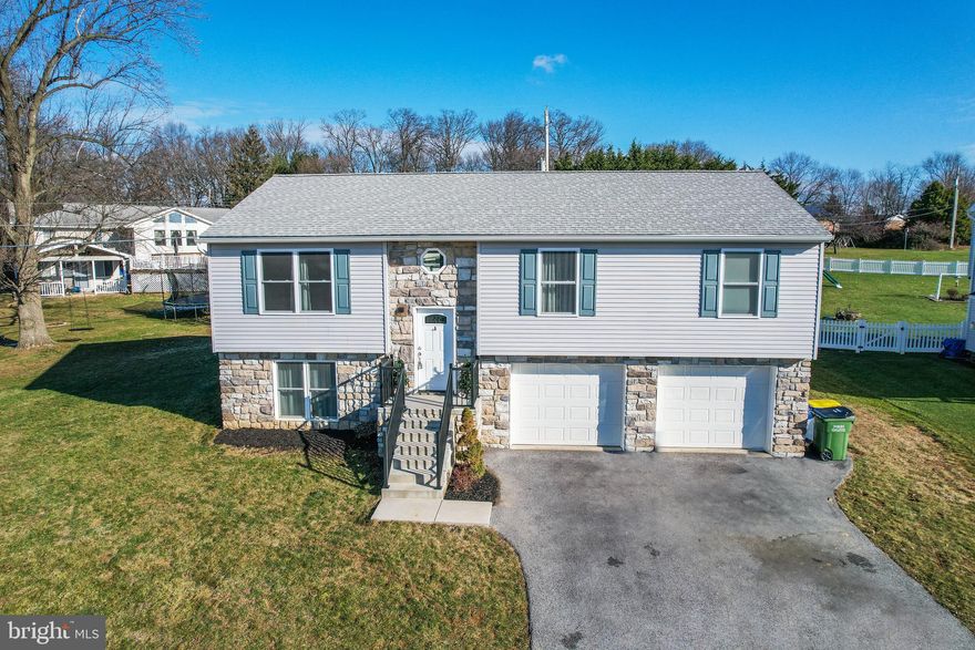 Welcome to 2817 Honey Valley Rd. in Dallastown—a dazzling embodiment of modern living, newly constructed in 2020! This exceptional split-foyer home boasts an open-concept floorplan that effortlessly combines style and functionality.

One of the highlights of this home is the abundance of natural light streaming into the living space, creating a bright and welcoming atmosphere. Every corner is bathed in sunlight, enhancing the contemporary charm of the home.

The kitchen is a culinary haven, featuring beautiful white soft-close cabinets, quartz countertops, and a generously sized kitchen island. Adding a touch of convenience, the sink is equipped with a motion-sensored faucet—making kitchen tasks a breeze. With ample cabinet space and stainless steel appliances, this kitchen is both practical and chic. The eat-in dining area seamlessly complements the kitchen, providing a cozy spot for casual meals or entertaining.

Throughout the entire home, revel in the luxury of LVP (Luxury Vinyl Plank) flooring, offering a sophisticated and durable foundation. The master bedroom is a private retreat with a full bathroom and dual closets, while the additional two bedrooms on the primary level also feature LVP flooring and spacious closets.

Downstairs, the lower level offers a completely finished bonus space—a versatile area perfect for a second living space, home office, or entertainment room. Storage and easy access to the 2-car garage complete the lower level, adding practicality to the home.

Situated on a level lot, this property features composite decking for maintenance-free living. Picture yourself relaxing or entertaining on the deck, creating cherished moments with friends and family.

This residence epitomizes "NEW NEW NEW!"—from its 2020 construction to its modern features and finishes. Don't miss the opportunity to make 2817 Honey Valley Rd. your home. Schedule a showing today to experience the contemporary elegance, convenience, and radiant living space firsthand!