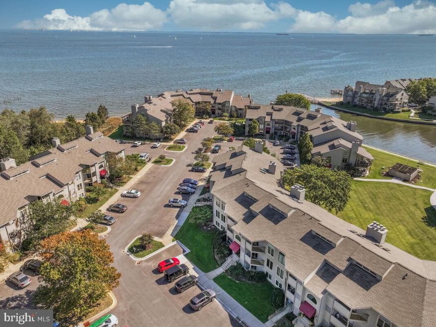 MOTIVATED SELLER!!!!  NOT a BETTER DEAL in Chesapeake Harbour!!!
This is a fabulous unit, and Welcome to Chesapeake Harbour! This beautifully updated WATER VIEW 2-bedroom, 2-bath condo offers the perfect mix of comfort, style, and easy living in one of Annapolis’s most sought-after waterfront communities is just waiting for YOU!
A MOTIVATED SELLER and located in one of the best buildings, at least that's the seller's opinion with a great view of the marina...and not looking at a ton of other units! 
Inside, you’ll find a fresh and modern vibe with a little fresh paint accented with ceiling fans throughout, new bamboo flooring, and a delightfully unique wooden fireplace mantel adding a cozy, custom touch to the living space. The open layout flows effortlessly from the living room to the dining area and kitchen, making it great for entertaining or just relaxing at home.
The kitchen has been upgraded with a new countertop, sink and faucet, and new dishwasher, new refrigerator,  plus stainless-steel appliances including a self-cleaning oven and built-in microwave. There are even a new washer and dryer tucked away for convenience. Both bathrooms have been refreshed with stylish upgrades, giving the whole place a clean, contemporary feel.
The primary suite is a peaceful retreat with its own en-suite bath and plenty of closet space. The second bedroom and bath are perfect for guests, a home office, or whatever suits your lifestyle.
Step out onto your private balcony to enjoy views of the marina and Chesapeake Bay—ideal for morning coffee or evening wine. And when you're ready to get out and about, the community has it all: a private beach, two pools, tennis courts, jogging paths, and 24/7 gated security. Need an EV charge for your car.  It's here.  Take a stroll along walking path along the marina and enjoy a meal at the on-site restaurant. There’s even water access for boating enthusiasts!
With off-street parking and services like lawn care and exterior maintenance included, this home makes it easy to enjoy the good life without the hassle.
Whether you're looking for a weekend getaway or a full-time residence, this Chesapeake Harbour gem feels like a vacation every day.