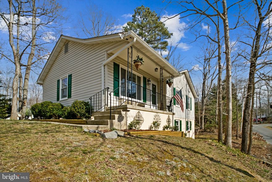 This raised rambler has been fully updated from head to toe and exudes  luxury in the truest sense.  Owners have completely poured their hearts into making this home shine. New roof in 2017, new windows, doors, patio, finished basement, freshly painted shutters, new tile flooring, updated bathrooms, soft-close kitchen cabinets/drawers, stainless appliances, granite countertops, marble kitchen floor, bamboo hardwood, and huge laundry/storage space make this home an ideal choice for anyone. Storage shed conveys as-is. Don't miss the incredible stone patio out back that wraps around to the walk-out basement and expansive seating area for outdoor enjoyment. HOA includes beach & lake access in addition to other amenities.