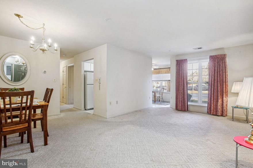 Move In To Easy Living With This Spacious, First Floor Condominium Home In Secured Building With Great Location. All Ages Welcome & Let Others Do The Grass & Snow! Features Open Floor Plan, Cozy Breakfast / Sun Room, Private Laundry Room, Patio With Storage Area, & Community Picnic Pavilion. Primary Bedroom Has 2 Walk-In Closets & One Has Rough-In For 2nd Full Bathroom. Reserved Parking Space #26 Is Conveniently Located Directly In Front Of Condo. Includes All Appliances & One Year Home Warranty - Schedule Your Showing Today!