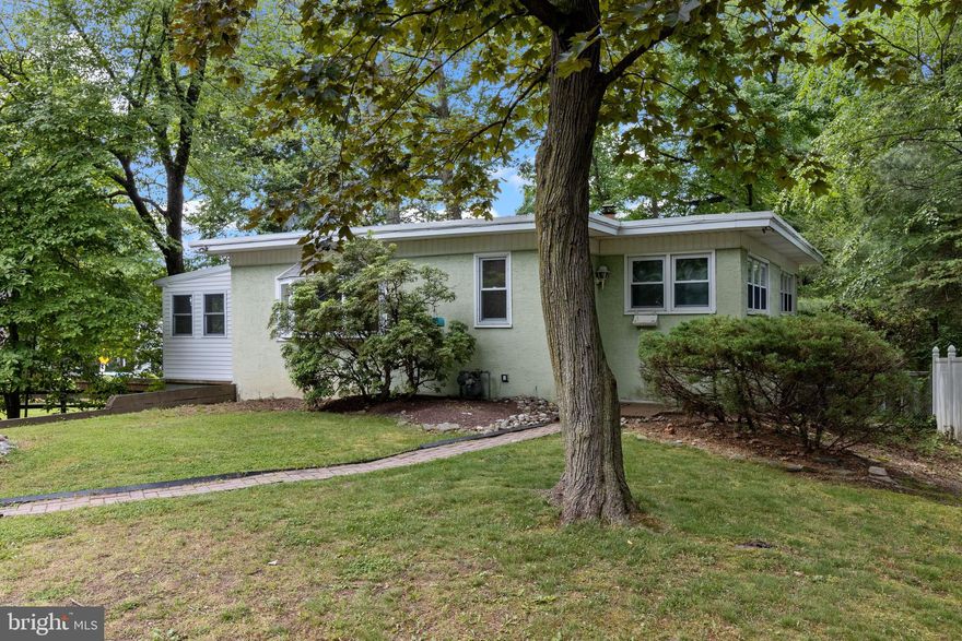 This is the one that you have been waiting for! There is a magnificent, serene quality to this three-bedroom charmer that simply sets the stage for what is to come. Step inside and enjoy the open layout that is offered, with plenty of space in all the right places! From the newly renovated lower level, where you will find the third bedroom currently being used as a home office, to a superbly appointed sunroom which leads to a secluded outside deck. There is something for everyone! The kitchen is the heart of the home, a true showstopper featuring beautiful white cabinetry, gorgeous backsplash and granite tops plus an additional exterior deck which is the perfect spot for soaking up the morning sun. Back inside and just down the hall from the living area, you will find a full bathroom and two generously sized bedrooms, both offering plenty of closet space and immense natural light. Saving the best for last is the lower level of the home, where there are endless opportunities. Recently updated and sure to please with new laminate flooring in the bedroom/office area and a freshly painted full bathroom  with lovely new tile flooring and vanity, the remaining finished space has been freshly painted as well and offers a convenient private entrance direct from the carport. The storage area with utility room, hot water heater (2020), HVAC (2018), and laundry room completes this level of the home. If you have not fallen in love already wait for it…the property borders the Briar Bush Nature Center, making it easy to access the walking trails and nature center activities. Amazing location with an added convenience that comes with being close to everything--schools, public transit, shopping, restaurants and more. Do not blink or this one will be gone!