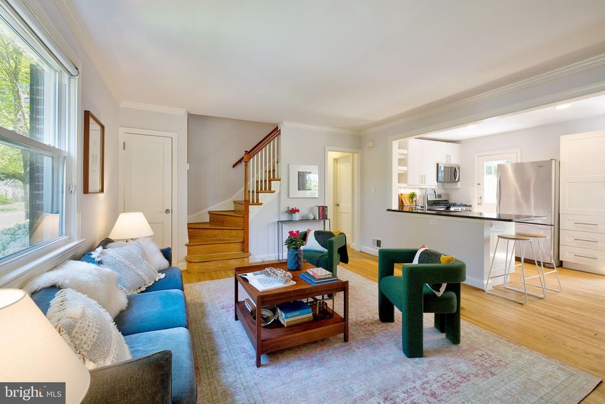 Charming and updated 4BR Cape Cod with a large yard on a prime corner lot in the sought-after neighborhood of Forest Estates! Enter through the enclosed front porch to find the bright and open main living space which features hardwood floors throughout, a large living room with wood-burning fireplace, a beautifully updated kitchen with stainless steel appliances and peninsula breakfast bar, and a dining area with custom built-in banquette seating. The main level also offers two bedrooms and a full bathroom with tub/shower combo. The second level features two additional bedrooms - including the stunning primary bedroom with multiple desk or reading nooks - and the updated second bathroom. The basement provides an  extra rec room, laundry, and plenty of storage space. Outside you can enjoy the back deck, the large yard, beautifully landscaped gardens and flower beds, and parking for 1+ in the driveway.  All located on a wonderful corner lot in beloved Forest Estates - a community that is convenient to the Forest Glen Metro, neighborhood parks, hiking and biking along Sligo Creek, golf and tennis, all of the shopping and restaurants in Woodside and downtown Silver Spring just a short drive away, and the excitement of DC just a few minutes beyond that. Welcome home!