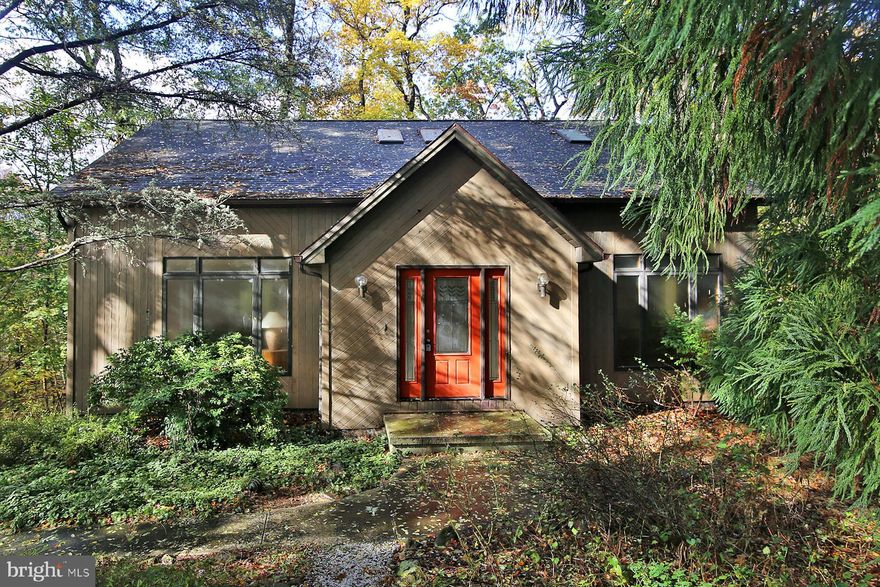 Priced to sell! This home is tucked away on a wooded lot surrounded by mature trees, this unique contemporary home offers peace, privacy, and endless potential! Currently designed with 2 bedrooms and 2 full bathrooms, the flexible floor plan could easily accommodate a third bedroom.  Step inside to find a bright, open layout featuring a open staircase with a balcony overlooking the living room, skylights, and large windows that flood the space with natural light.

The main level includes a spacious living room, dining area, kitchen, family room, bedroom, and full bath — perfect for comfortable everyday living.

Upstairs, you’ll find an open loft area, laundry room, and a primary suite offering privacy and a great view of the trees.

The walk-out lower level is a blank canvas, ready to be finished for extra living space, a workshop, or whatever suits your lifestyle. There’s also convenient access to the oversized 1-car garage.

This home combines modern architecture with natural surroundings — a rare find in the Hershey School District!
