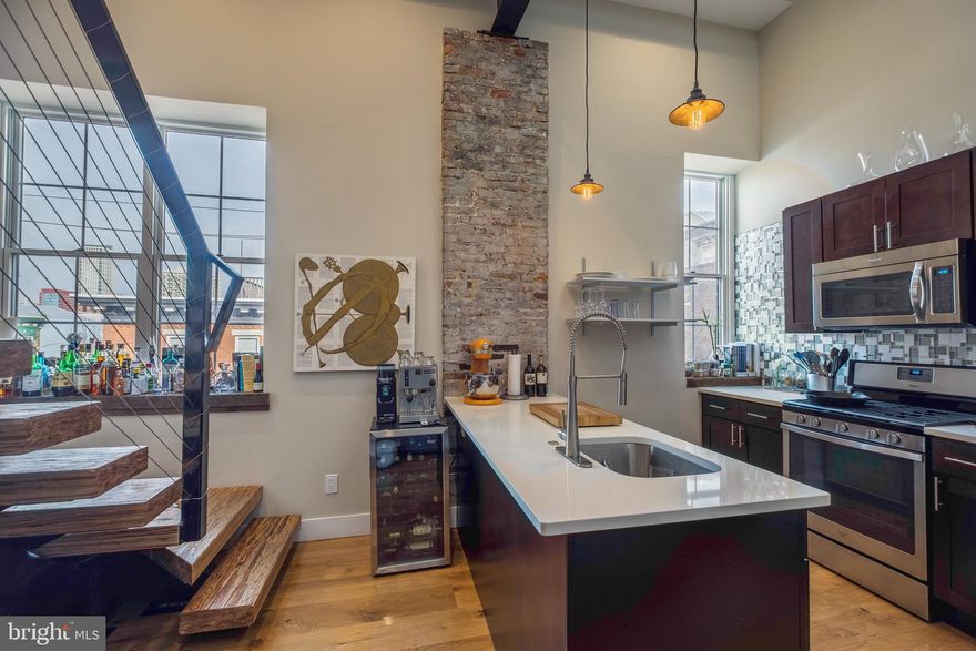 Pirce is Net effective rent $3300, based on 18 month lease with one month free.  Monthly Lease $3495.  

 Unbelievable 2-bedroom, 2-bath penthouse in the heart of Queen Village! This one-of-a-kind residence sits atop a fully renovated 100-year-old industrial building at 5th & Monroe, blending original exposed brick and beams with modern luxury finishes.

The dramatic open living area features 26’ ceilings, reclaimed white oak flooring, Restoration Hardware lighting, and a wall of windows flooding the space with natural light. A custom floating staircase leads to a private office loft overlooking the city.

Enjoy incredible, unobstructed 360° views from the private wraparound roof deck, including Center City, the river, and the Ben Franklin Bridge — perfect for entertaining or relaxing.

The spacious layout includes a primary suite with an en-suite bath and double vanity, a guest bedroom with two large closets, a full guest bath with tub, and an in-unit washer/dryer.

Located in the heart of Queen Village, you’ll be surrounded by some of the city’s best dining and have easy access to Old City, Bella Vista, Washington West, Midtown, and greater South Philadelphia. A rare opportunity to enjoy modern luxury with historic charm in one of Philadelphia’s most sought-after neighborhoods.

Features:

26’ ceilings with exposed beams
8” reclaimed white oak floors
White quartz countertops
Stainless steel appliances
Restoration Hardware fixtures
Redwood lathe accent walls and reclaimed details
In-unit washer & dryer

You won’t find another apartment that combines stunning architecture, design, and panoramic views like this one!