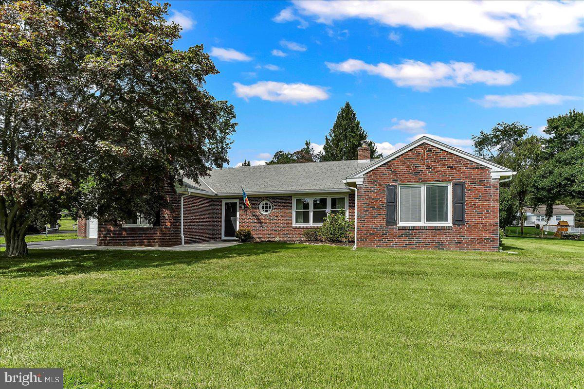 All showings to begin at the Open House on Sunday, September 14, 2025. Photos coming mid week. This beautifully maintained expansive brick ranch home, situated on a half acre lot, is located in one of Newtown Square's most sought after communities. The home sits on a 112 Sq Ft x 200 Sq Ft flat lot with a front access two car garage. Charm and character are evident in this property. You enter the home from a concrete walkway into an east to west front foyer. To the left of the foyer is a wing that houses one bedroom, one bath and the kitchen. To the right of the foyer is the front to back formal living. The formal dining room is located behind the foyer and it is accessed from the foyers and the kitchen. The wing to the right of the house includes two bedrooms and a full bath. An enclosed breezeway leads to the two car garage. This breezeway opens to both the driveway and the rear of the house and has entrances to the garage and the kitchen. The front foyer has a large double closet. The house has hardwood floors throughout (except kitchen and baths). The half acre lot is wide open and level. The Full unfinished basement spans the entire footprint of the house and is available to be finished if desired. Both basement and main floor laundry are available. The fireplace is wood burning, yet lines have been installed for propane if desired instead. Additional storage is available in an attic above the main level. A truly special home in excellent condition, especially those for wanting an open sunlit space with one floor living. Newly renovated bathroom 2024/2025, Kitchen Cabinets Updated 2024/2025, New Front concrete walkway and rear patio 2021, New oil Tank & Lines 2020. The community is conveniently and strategically located to public transportation (bus and train), Routes 95, 202 , the PA turnpike and Blue Route, shopping and recreation, hospitals, the Philadelphia airport and King of Prussia, etc.
