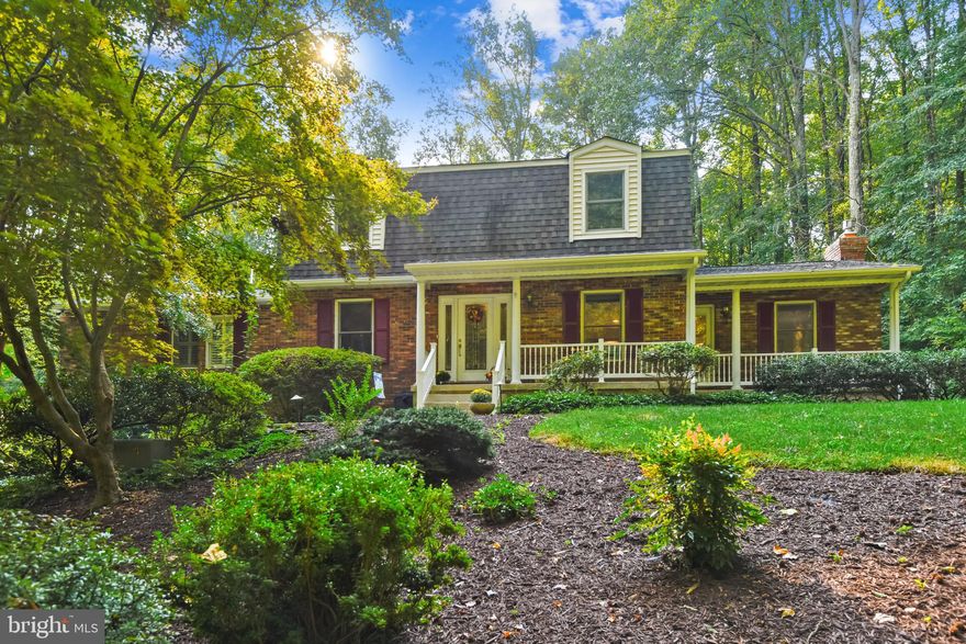 This 4 bedroom, 4 full bath dutch colonial in Crownsville is a hidden gem and a must see!  Located in Baldwin Hills South, 1298 Dorothy Road is tucked back at the end of the cul-de-sac, hidden from view from the road.  Your own oasis of privacy, it sits on almost 3 acres of land.  The open floor plan on the main level allows an easy flow from the living room and kitchen to the dining room.   The kitchen includes stainless steel appliances, granite countertops, and both recessed and pendant lighting.  The living room includes a stacked stone, gas fireplace, and opens into a spacious sun porch.  The main level primary suite is just off the dining room, with dual sinks, jacuzzi tub, walk in closet, and slider access to the deck.  The upper level offers a second primary suite, plus two bedrooms and an additional full bath.  The finished basement level includes a family room, full bath, two finished bonus / storage rooms, and the two car garage.  The attached deck offers over 1,200 square feet of entertaining space that looks out into the woods.  An additional detached deck offers over 500 square feet of space, designed to make an above-ground pool feel like an in-ground.  Outside the living room is the koi pond, with two waterfalls built into the side hill.  The entire property is extensively landscaped, for beautiful views of nature from every angle.  Just a couple blocks from the Baldwin Hills swim club, and a few minutes drive from all the shopping of Waugh Chapel and Crofton.  Easy commute to Washington DC, Annapolis, and Baltimore.  See it today!