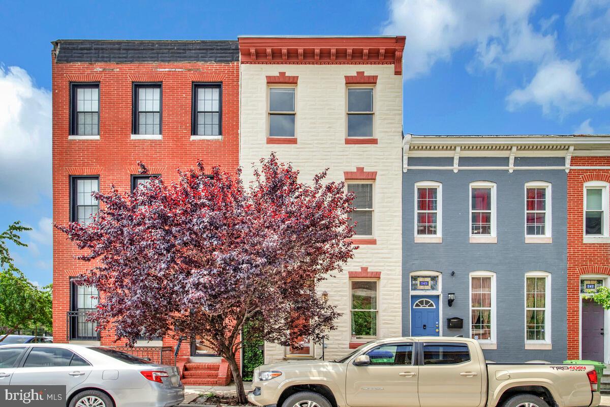 Live at the center of it all—this beautifully designed home offers the convenience of city life paired with smart, functional living. Nestled in a commuter-friendly location, you’ll be just minutes from major highways including I-95, I-695, BW Parkway (295), and BWI Airport. Quick access to the light rail, Greyhound terminal, and Baltimore’s cruise port makes travel effortless. Love sports, nightlife, and entertainment? You're perfectly positioned to enjoy Ravens and Orioles games, downtown events, and the Inner Harbor. You can even host pre-game gatherings in your private courtyard with side-alley access—a rare urban feature. This home is thoughtfully laid out across three levels with a private rooftop deck that offers sweeping views of the city skyline. It’s the perfect spot to take in fireworks, sunsets, or a quiet evening above the city buzz. The top-level is a dedicated primary retreat, complete with a tray ceiling, dual walk-in closets, and a private en-suite bath. An independent HVAC unit on this level ensures year-round comfort tailored to your needs. On the second floor, you’ll find two spacious bedrooms, a shared full bath with tub/shower combo, and a conveniently located stackable washer and dryer. The front bedroom includes double closets for generous storage. The main level features a welcoming living room and separate dining area, ideal for hosting or everyday living. The kitchen is outfitted with granite countertops, stainless steel appliances, pantry, and a 5-burner stove—ready for holiday meals or weeknight cooking. The lower level provides additional storage space and houses a second full-size washer and dryer for added convenience. With walkability, rooftop views, a private outdoor courtyard, and easy access to everything the city offers, this home delivers a rare mix of comfort and connectivity.
📲 Schedule a tour and see what city living looks like when it’s done right!