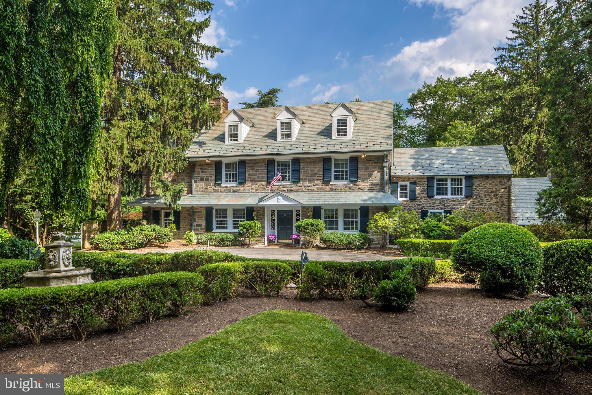 Presenting 141 Maple Hill Road, an oasis for family living and indoor-outdoor entertaining, in one of the best locations on the Main Line! Nestled on 3.13 acres of pristine landscaped grounds in prime Gladwyne, this architectural beauty has something for everyone including a sparkling pool, pool house, and tennis court, plus expansive patios, gardens and lawn for all kinds of summer fun. The gorgeous stone with slate roof exterior exudes classic elegance, and practically every inch of the home has been recently and meticulously redone with all the modern amenities one could desire. Among the extensive list of improvements are new plaster, coping & tile in the pool; a freshly painted pool house with new doors, kitchen, gym & full bath; a full house & pool house generator; a new 2-story wine cellar with Wine Guardian chiller; new water heater; new lighting inside & out; refinished & new hardwood flooring; a top-of-the-line new chefs kitchen; and all new impeccably renovated baths. Rarely does an offering of this caliber & attention to detail come along, offering 6 bedrooms, 5.2 bathrooms, and a gracious floor plan with generous formals & private spaces. The grand center hall flows into a large living room with a fireplace, and dining room with French doors leading outside. Prepare meals and gather with guests & family in the stylish all-new gourmet kitchen featuring a quartz-top island and suite of premium Bosch, Wolf & Sub-Zero appliances. Coffee & casual fare can be enjoyed in the sun-filled breakfast room, also with a gas fireplace, or out on the lovely adjoining patio with pool & tennis court views. A vaulted family room with fireplace & massive windows sits nearby for relaxing days & evenings. Three strategically-positioned wet bars afford ease of serving favorite beverages & cocktails. Comfort continues on the main level with a handsome office, elegant powder room & convenient mudroom. Well-appointed sleeping quarters await upstairs, with 4 bedrooms, 3 baths & a laundry room on level two, and 2 bedrooms + full bath on level three. The luxurious primary retreat comes with a custom walk-in closet for your belongings and an immaculate new spa bath that pampers with radiant heat floors. The basement with fresh paint, new flooring, lighting & powder room houses the fabulous 2-story, 3,300-bottle wine cellar plus a bar & tasting area. A 4-car detached garage & circular drive accommodate multiple vehicles. Situated on a tranquil no-through-traffic street, with your property bordering Bridlewild Trail if you feel like a hike. Or take a short walk to the Village of Gladwyne. Access to award-winning Lower Merion schools, and a quick ride to Center City & the airport make the location irresistible.