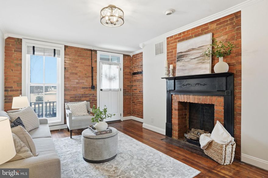 Classic Remodeled Brick Townhome in Downtown Frederick

Welcome to a rare end-unit treasure in the heart of Frederick’s Historic District.  Here, vintage charm meets modern comfort. This beautifully renovated townhome blends exposed brick, original hardwood floors, and historic character with today’s must-have upgrades, including full HVAC, a Nest thermostat, and updated electrical systems.

Originally built in 1925, the home underwent a major renovation in 2010, with additional bathroom updates in 2021.

The main level offers a spacious living and family area anchored by a cozy gas fireplace, flowing seamlessly into a custom kitchen featuring granite countertops, tile backsplash, gas range, and stainless-steel appliances. A convenient bump-out adds a washer/dryer area and half bath, then leads out to your private backyard oasis with a new patio and privacy fence, perfect for summer dinners or morning coffee.

Upstairs, the character continues with exposed beams and brick in the primary suite, complete with an updated ensuite bath and towel warmer for that little touch of everyday luxury. A second bedroom or flex space includes more exposed brick and a walk-out porch, just steps from the renovated full hall bath.

Enjoy the convenience of your own garage and parking space with ample street parking.

Live the downtown lifestyle with breweries, restaurants, boutiques, art galleries, and local attractions, but retreat to your northern Historic District quiet retreat. You’re also less than a mile from MOM’s Organic Market, Starbucks, CVS, parks, and playgrounds, because convenience is the ultimate luxury.






Recent Updates:
- Front porch (Oct 2025)
- Patio, backyard, and fencing (July 2025)
- HVAC serviced (Sept 2025)
- Fresh interior paint
- Updated Roof