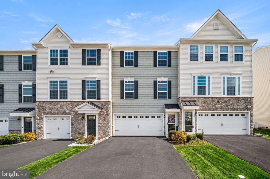 Welcome to this beautifully updated and spacious townhome in the highly sought-after Perkasie Woods community. Perfectly positioned and one of the larger models in the neighborhood, this freshly painted home offers the ideal blend of comfort, functionality, and convenience.This desirable layout features 3 bedrooms, 3 full baths, and a main-level powder room — a rare and highly functional design within the community. The sun-filled main level showcases an open-concept layout with a bright and airy living space that flows seamlessly into the eat-in kitchen. The kitchen is thoughtfully designed with a center island with seating, breakfast bar, pantry, stainless steel appliances, and abundant cabinet and counter space — perfect for both everyday living and entertaining.  Just off the kitchen, the main living area opens to a second-story rear deck through sliding glass doors, offering a peaceful, private setting to relax and unwind. A stylish powder room completes this level.  Upstairs, you’ll find three generously sized bedrooms, including a spacious primary suite featuring a large walk-in closet and an ensuite bath with a soaking tub, walk-in shower, and dual vanity. Two additional bedrooms share a well-appointed full bath with bathtub, and a dedicated laundry room adds everyday convenience. The fully finished walk-out lower level provides exceptional versatility, complete with a family room, Murphy bed, and a full bath — ideal for guests, extended stays, or additional living space. Sliding doors lead to a covered rear patio with a finished concrete pad, creating a seamless indoor-outdoor living experience. This level also offers access to the two-car garage and a spacious driveway.  Perkasie Woods offers a vibrant community atmosphere with a playground and neighborhood events. This community backs directly to Lenape Park, giving you front-row access to local favorites like live music, car shows, fireworks, and seasonal festivals. A dog park is just across the street, and you’re minutes from downtown Perkasie and Sellersville.  Residents also enjoy access to miles of scenic walking trails, a library, and multiple recreational amenities including pickleball, tennis, volleyball, and basketball courts — plus a community pool available for an additional fee.  Don’t miss the opportunity to own a home that combines space, style, and an unbeatable location.