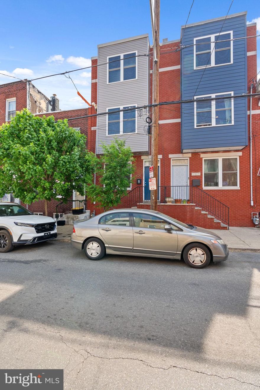 Welcome to 1225 S. 19th street! This Lovely 3 story home w/3 outdoor spaces & 2.5 baths with fully finished Lower Level & high ceilings is ready to go! This well cared for home sits in the Northern Pocket of Point breeze just south of Graduate Hospital and steps from the recently updated Chew Playground and Wharton Square Park! You'll find hardwood floors throughout main entry and all upper levels and bedrooms, Stainless steel appliances package, 1st floor half bath for convenience and sliding glass door that leads you to a large private patio. the 1st of 3 outdoor spaces. The 2nd floor you'll find 2 great size bedrooms on the West & East facing ends of the home separated by 2nd floor laudry and the 1st full bath. The 3rd floor houses Primary suite and bath with large closet and a two tiered outdoor space, a balcony off primary level and stairs that take you up to your large roofdeck with Premium unobstructed Skyline views! The finished Lower Level has ample space, natural light and high ceilings, making it ideal for a 2nd living space, office, home gym, play room or however you see fit to use it.  Not far from Target, Sprouts Market, Broad street line, great city space with plenty of local convenience & new neighborhood restaurants!