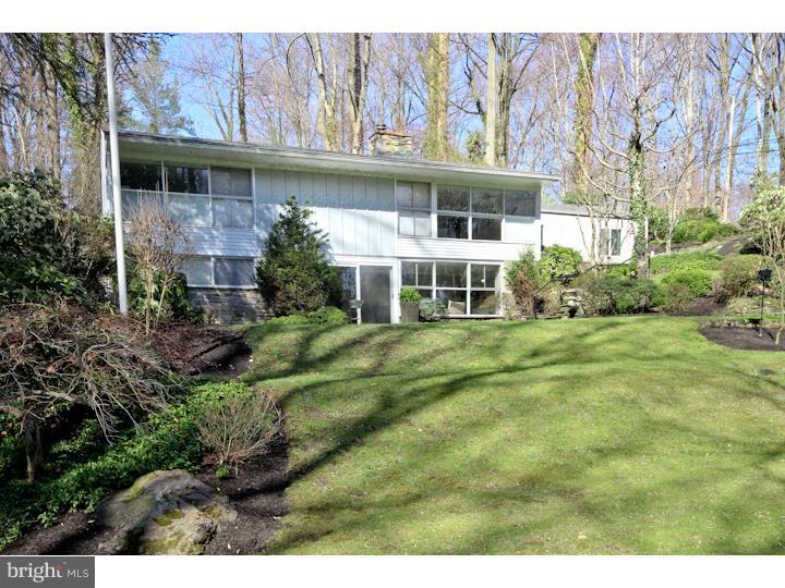 This showcase home in Upper Providence is like no other! 4 bedrooms, 2 full bath & poised on more than 1 acre lot accessible from both Paxon Hollow Rd. & Dog Kennel Rd, this home has been lovingly remodeled w/in! Recent upgrades to this home include an all new kitchen w/ bar, top-of-the-line cherry cabinets, granite counters, stainless steel appliances & beautiful stone floor. The living room has been expanded & finished w/ recessed lighting, wall-to-wall carpeting & custom banquette seating along one wall. The Dining area is HUGE w/ floor to ceiling windows & attractive stone fireplace. Hardwood floors have been refinished throughout! Custom blinds on all windows can be used to make the space more private, or opened to enjoy views of the sprawling lawn. Completing the first floor are two large bedrooms w/ lots of natural light & closet space & a full hall bath w/ ceramic tile surround & an extended vanity w/ extra counter space. Downstairs is a huge, sunny living space w/ fireplace, gorgeous hardwood floors & outdoor access to stone patio & lawn. Also on this level are two more carpeted bedrooms, another full bath w/ stall shower & a laundry/storage space. Home has a new energy efficient heater, has been upgraded w/ central a/c, 200 amp electrical & a new security system. Outside is both open & secluded. Off the kitchen is a stone patio area w/ tiered stone walls & gorgeous landscaping. The other side of the home has a magnificent, expansive lawn that slopes all the way down to Dog Kennel Rd. & additional street parking. Another stone patio area & storage shed on the side lawn leads back to the home through a stone stair path. Adjacent to Rose Tree Park & just minutes to downtown Media Shops & Restaurants this home is in the perfect location. Rose Tree Media schools. Close to public transportation & major highways. 30 mins to Philadelphia, 15 minutes to PHL Int'l airport.
