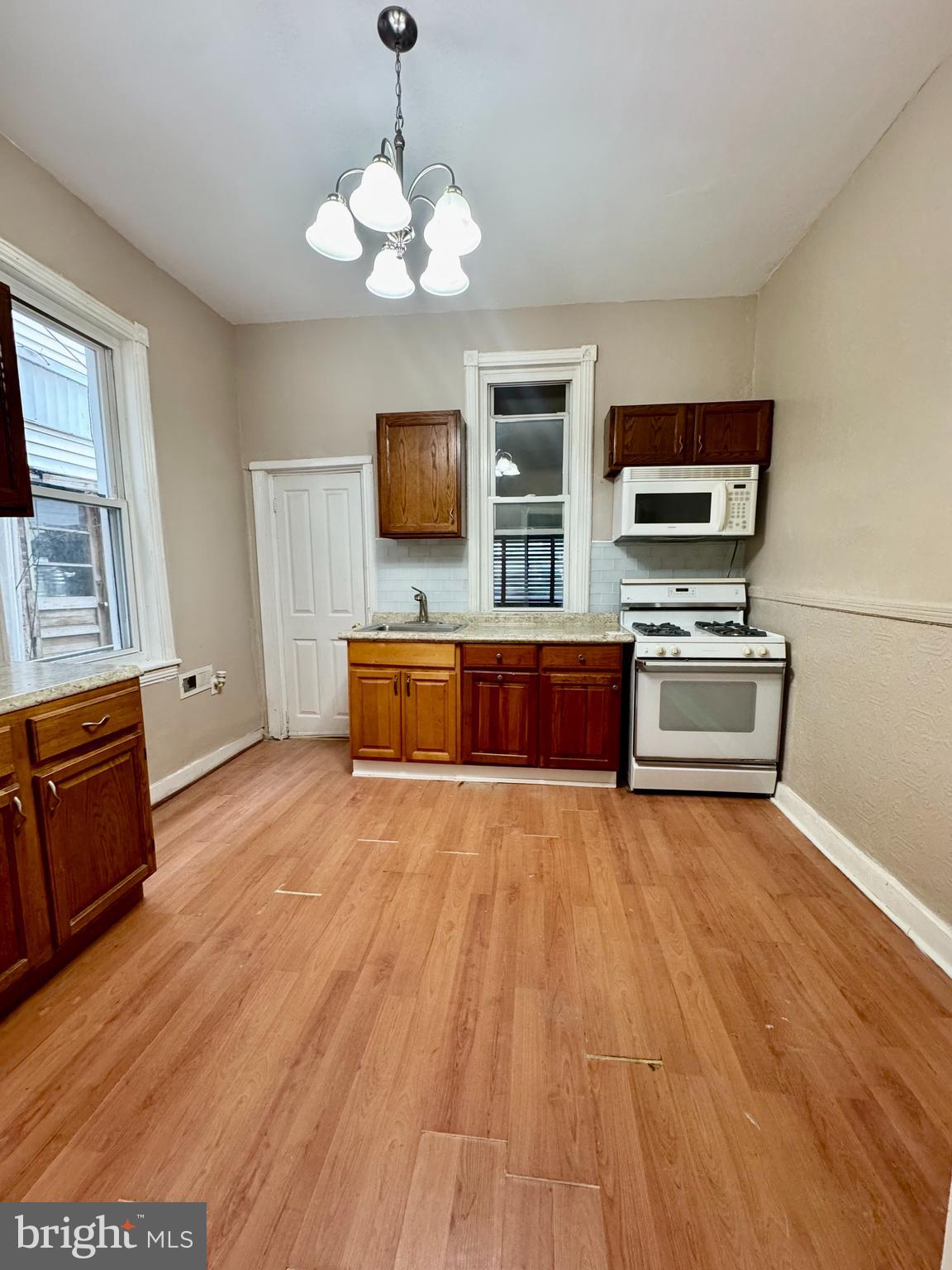 Beautifully updated 3-bedroom, 1-bathroom home featuring a welcoming front porch, laminate flooring on both the main and upper levels, and a spacious kitchen with all appliances included. The private, fenced rear yard provides the perfect space for outdoor enjoyment, and washer/dryer hookups are available for added convenience. Section 8 is welcomed, no pets are permitted, and the property is ideally located with easy access to shopping and public transportation.